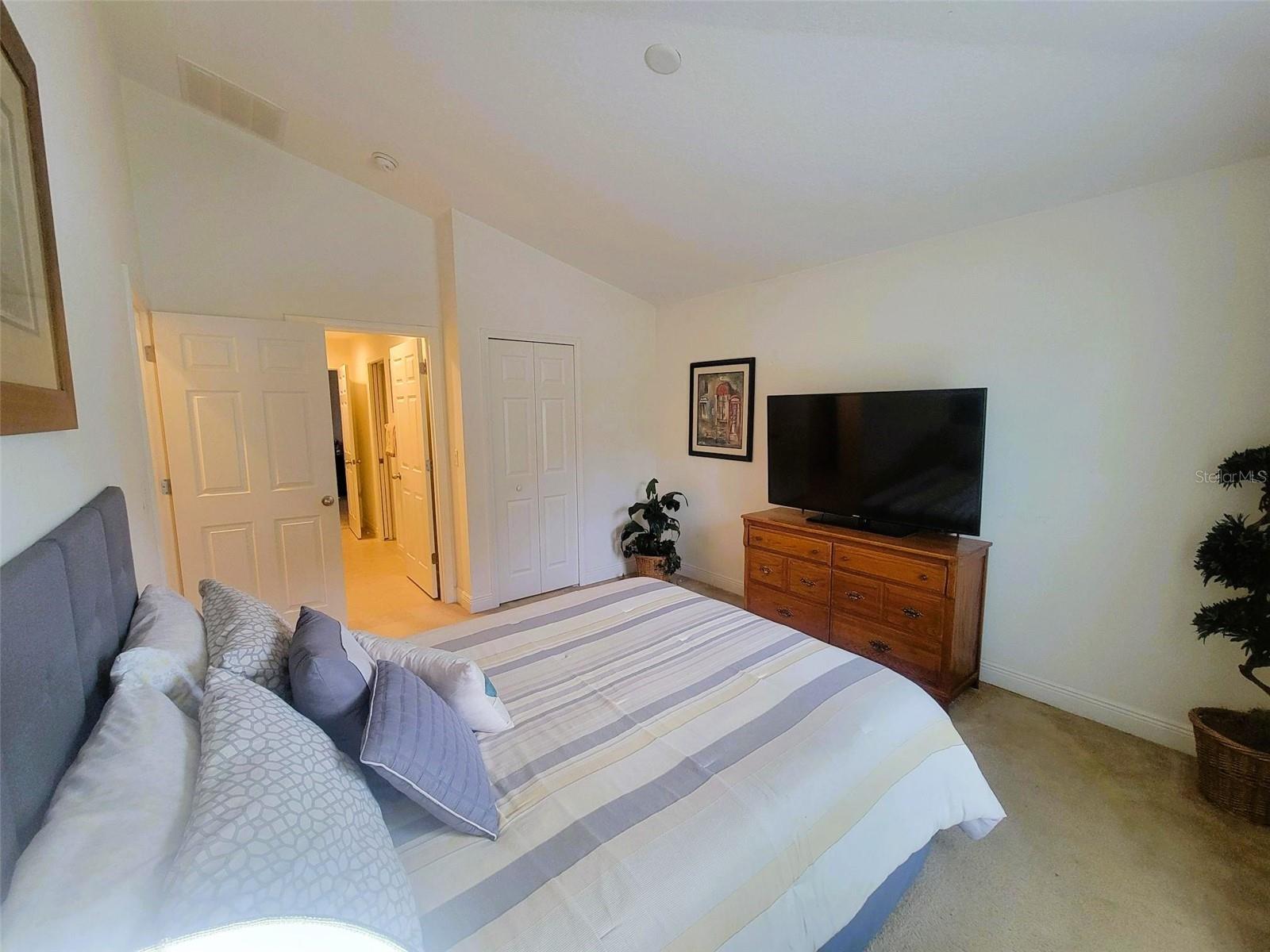 Comfortable bedroom with neutral tones, generous closet space, and direct access to the Jack-and-Jill bathroom.