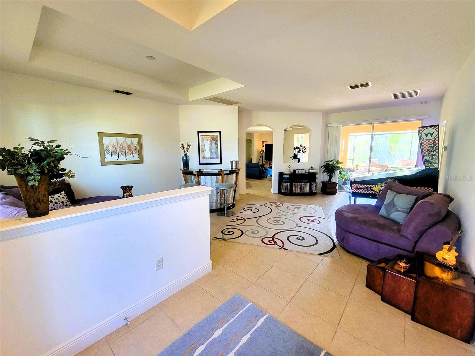 Enter through an elegant etched glass door into a light and bright living and dining room combination