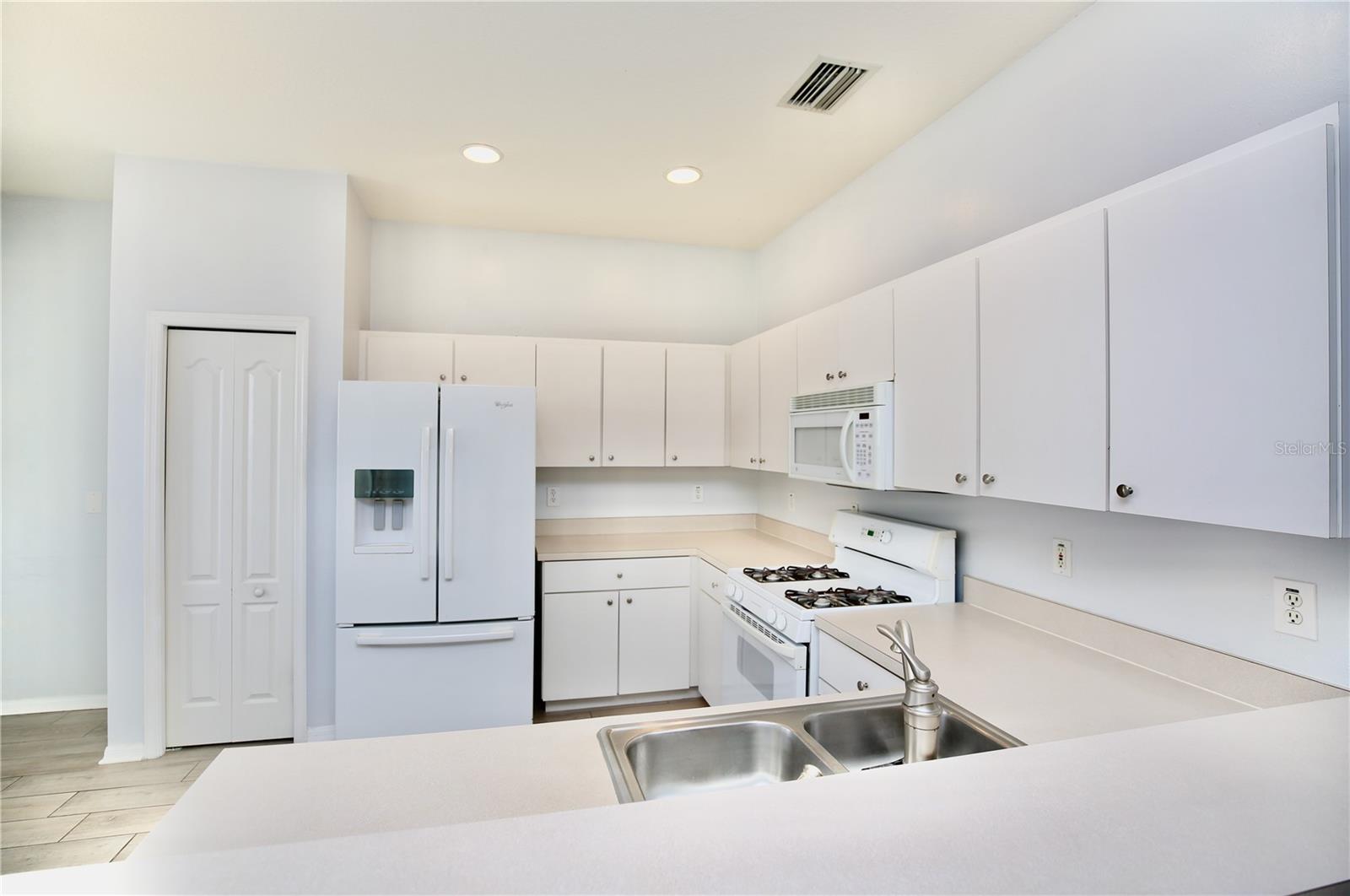 white kitchen and dinette space