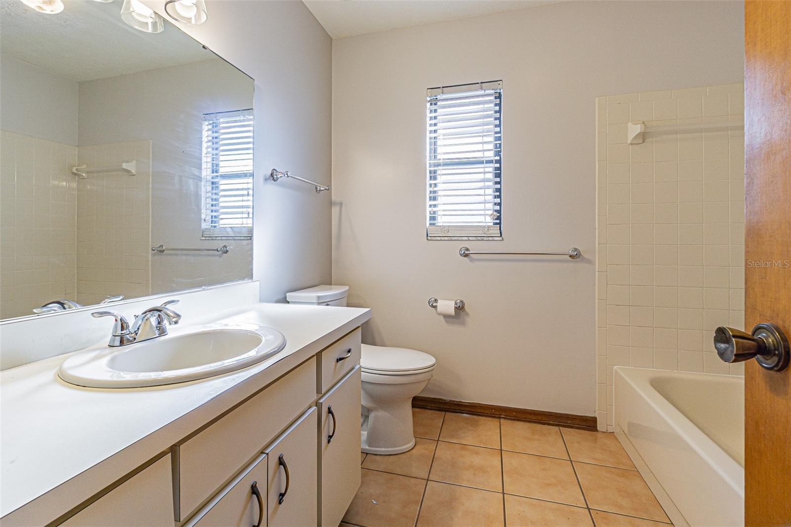 Bathroom 2 with new light fixture and new accessory fixtures