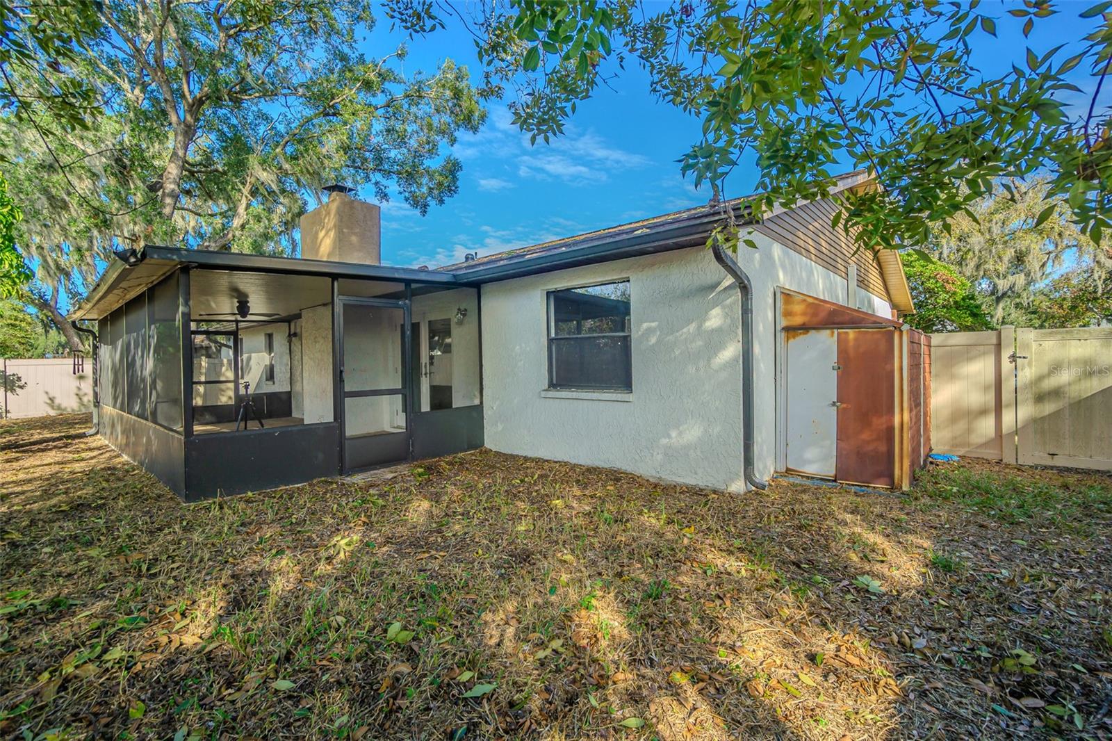 shaded fenced backyard