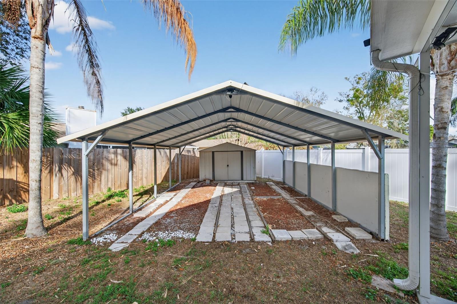 Parking Pad and additional Carport and storage shed