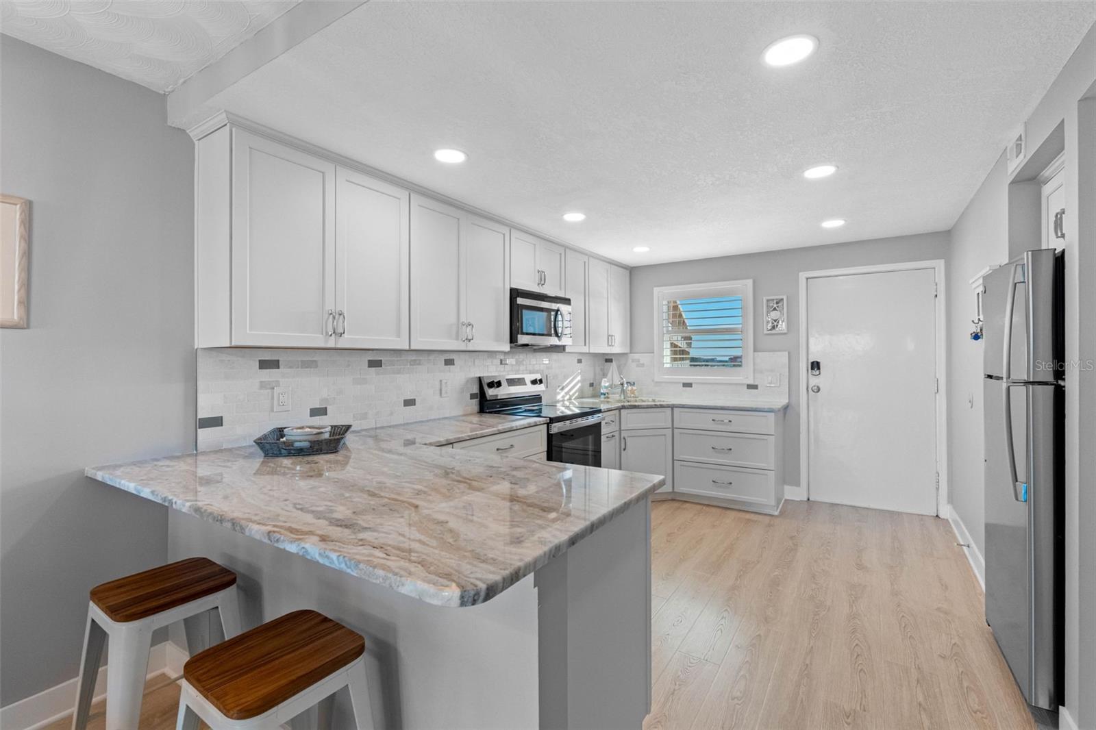 ..  Kitchen Photo #1. Complete Remodel.. Kitchen Was Opened & Remodeled .. All Work Completed. Solid Wood Cabinetry - Granite Counter Tops -  New Window - New Flooring and New Lighting.