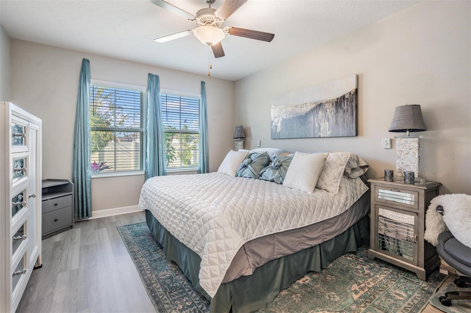 Primary bedroom w/luxury vinyl flooring