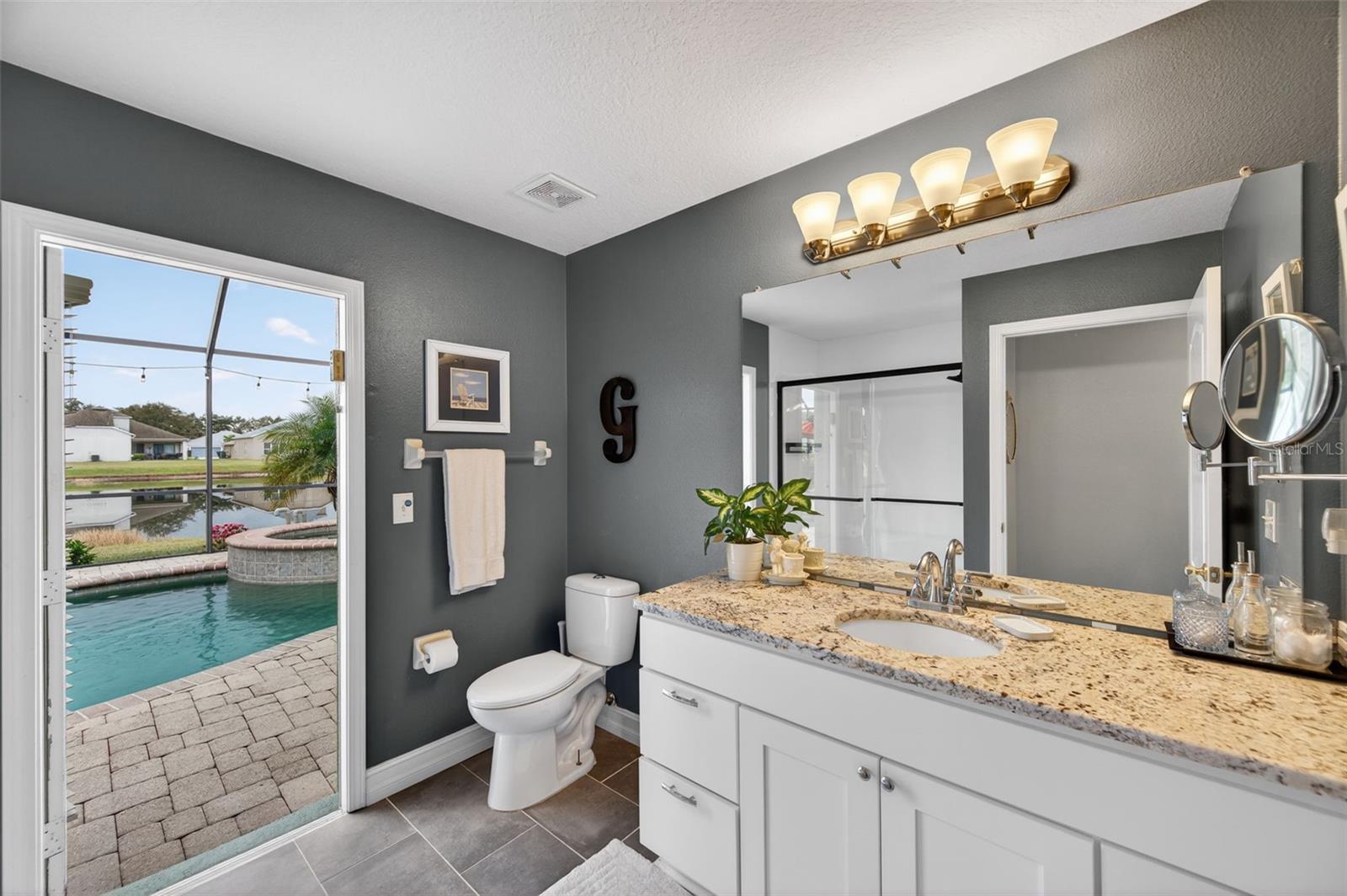 Bathroom 2 and door leading to pool area.