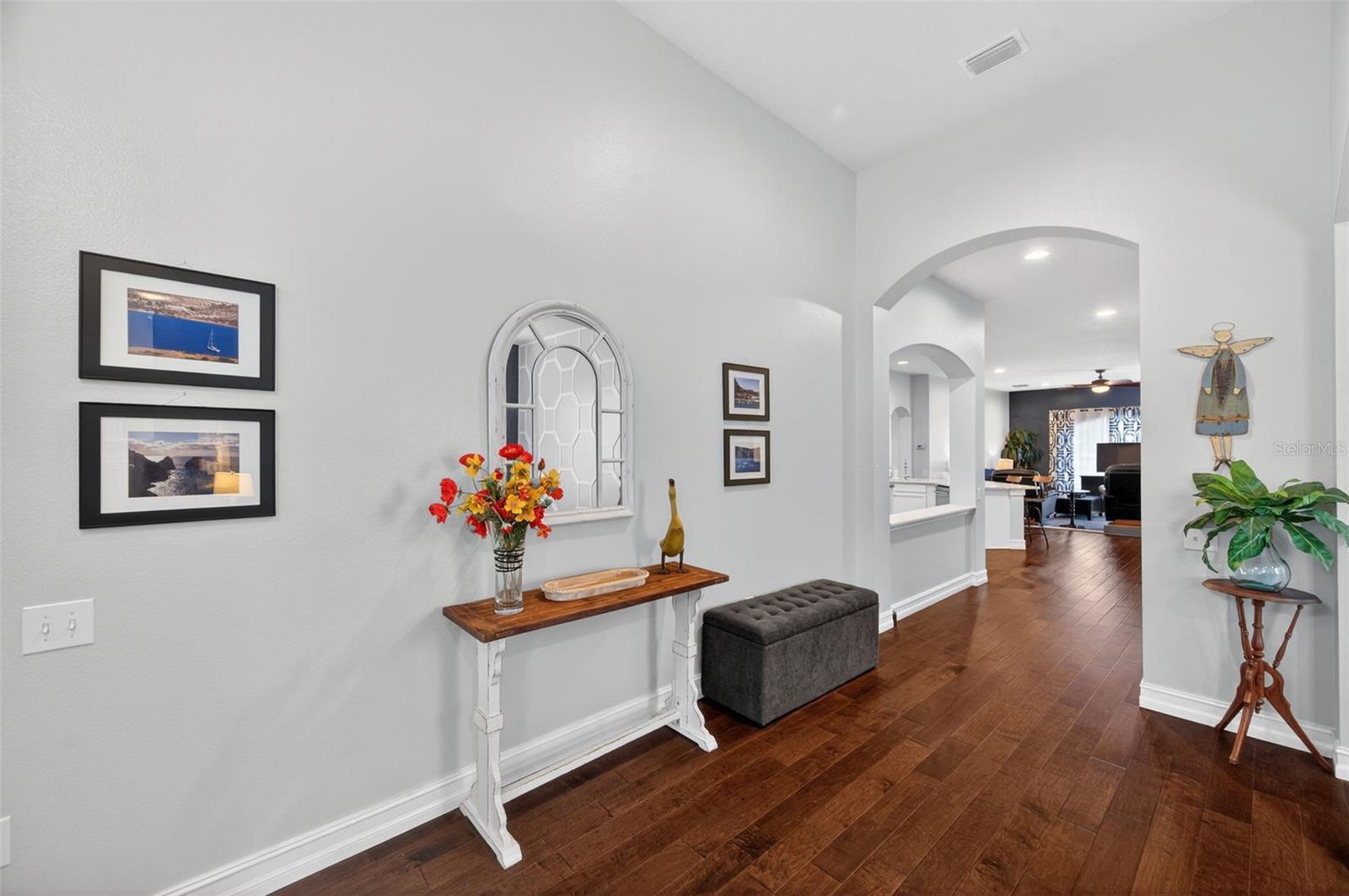 Entryway leading towards kitchen and family room