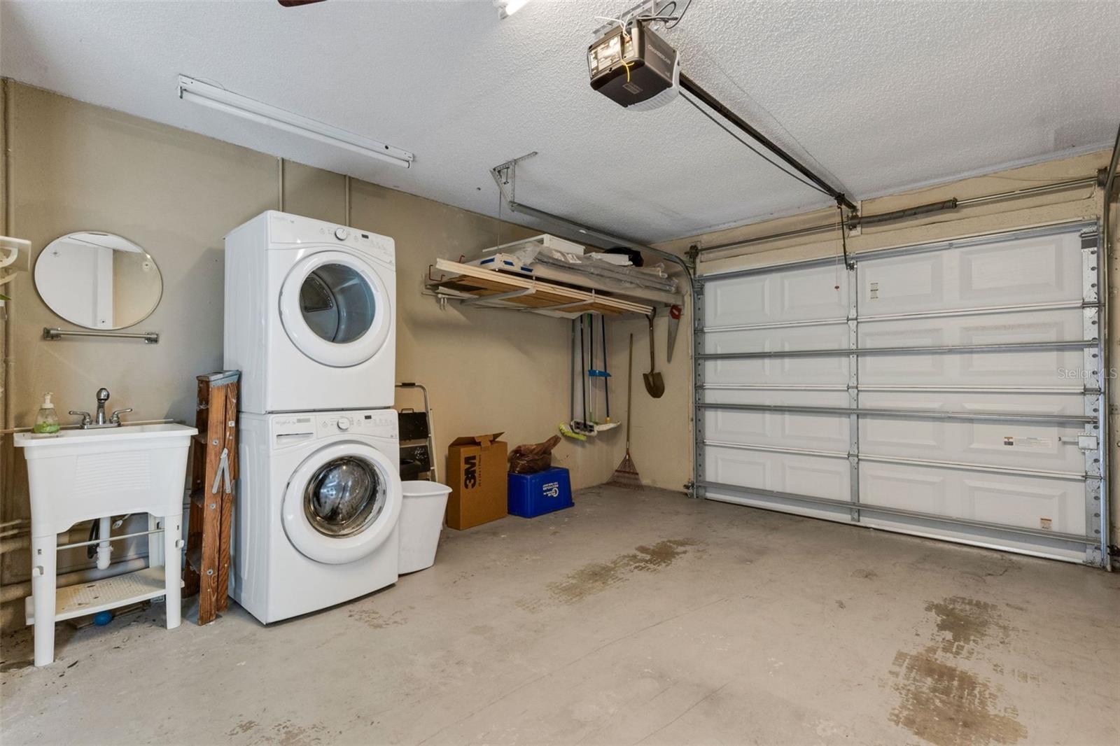 Utility sink and stackable washer and dryer
