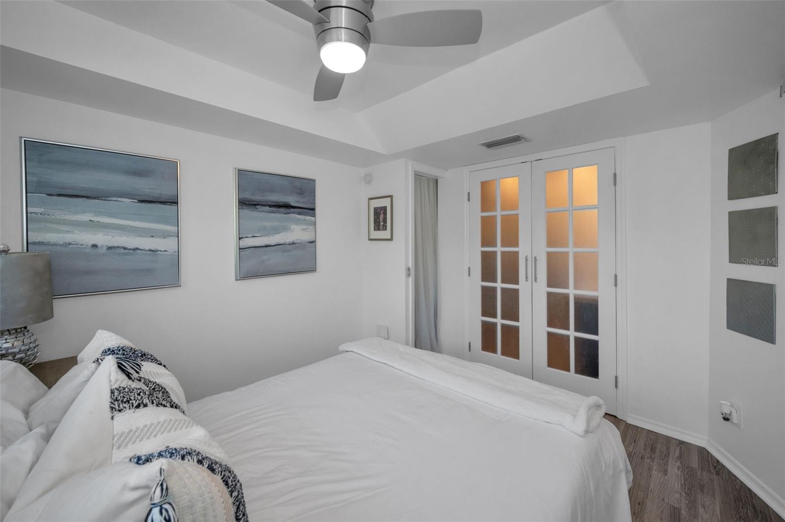 Main level bedroom with Double Doors to the Kitchen