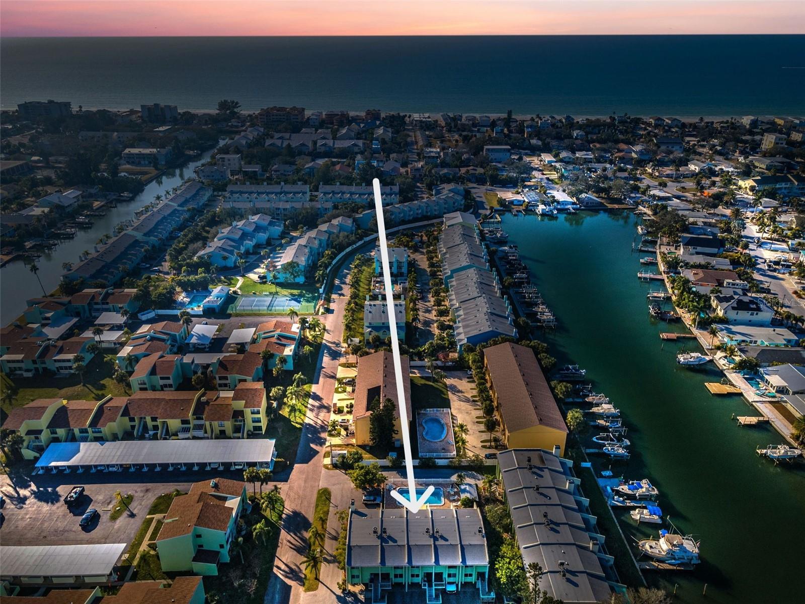 Evening aerial photo of the Condo for Sale at Indian Harbor!