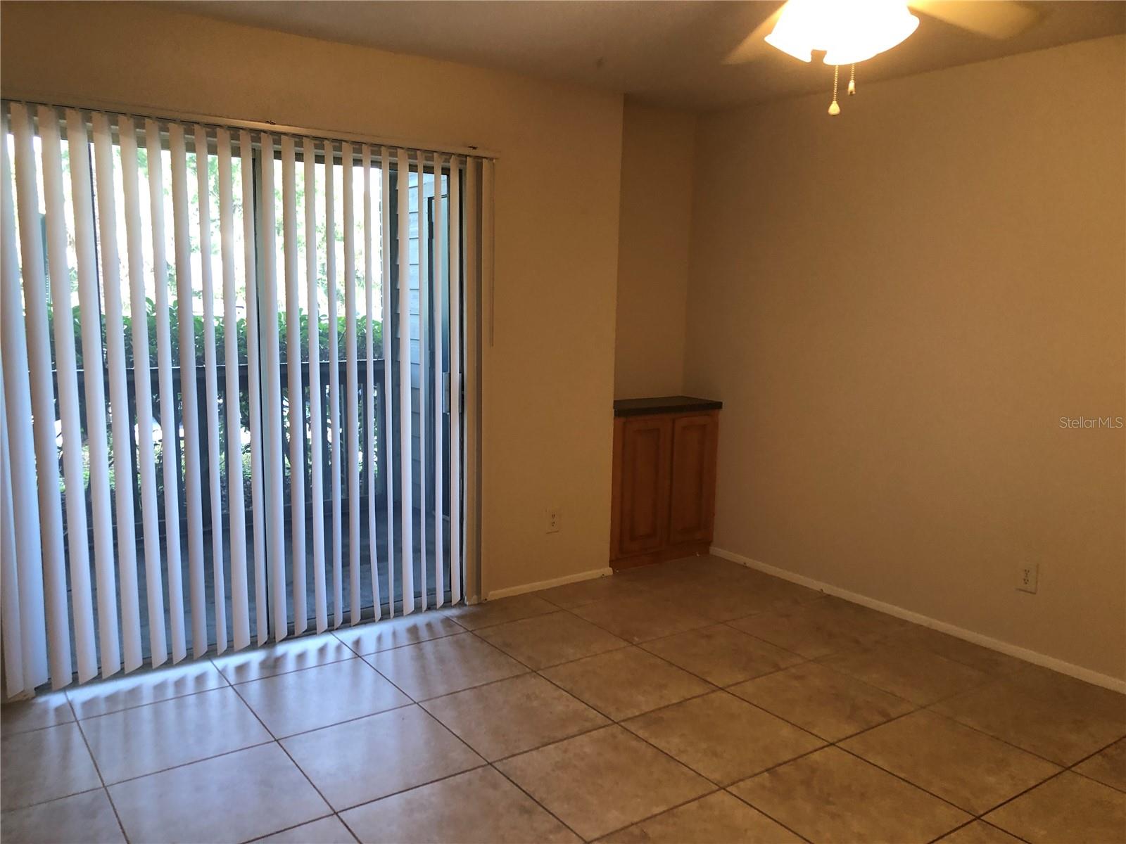 Living Area W/ Sliding Doors to Screened Patio