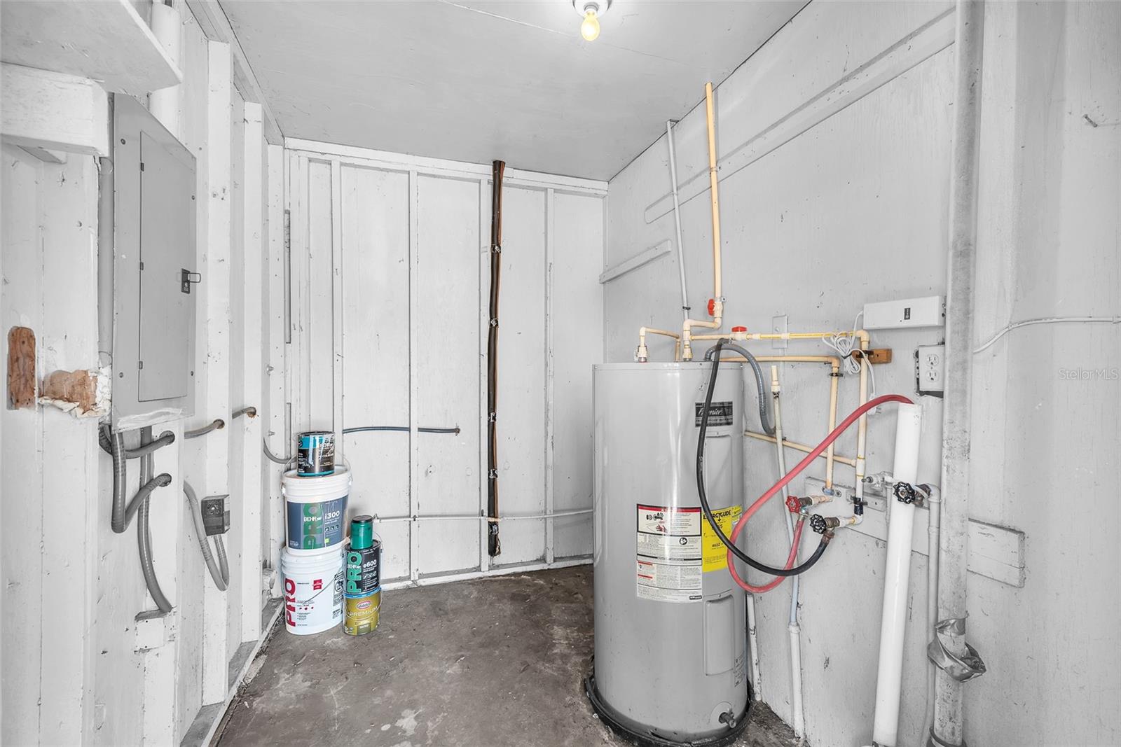 Storage room next to carport with Laudry hookup and newer water heater.