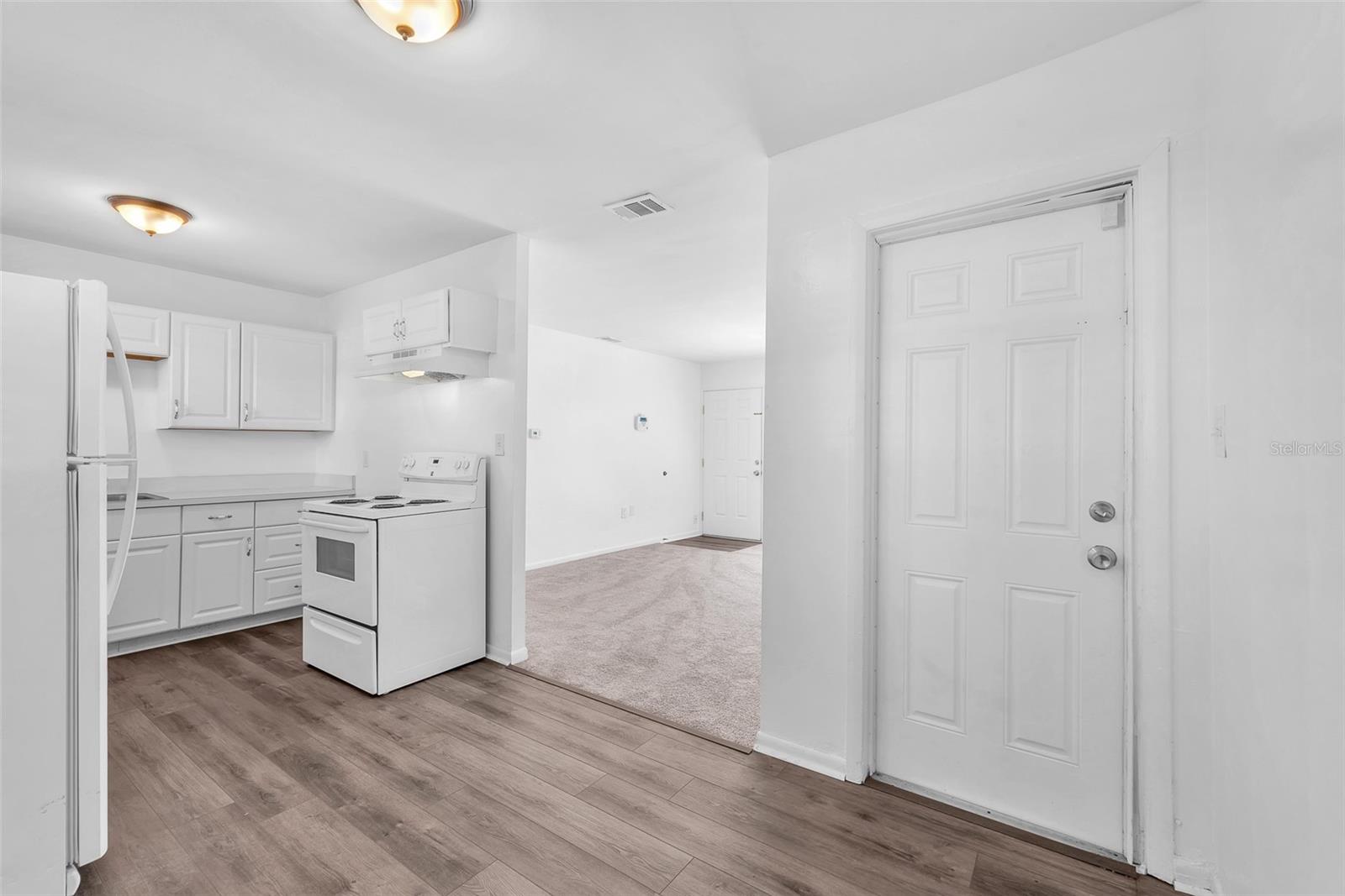 Access door in kitchen to carport.