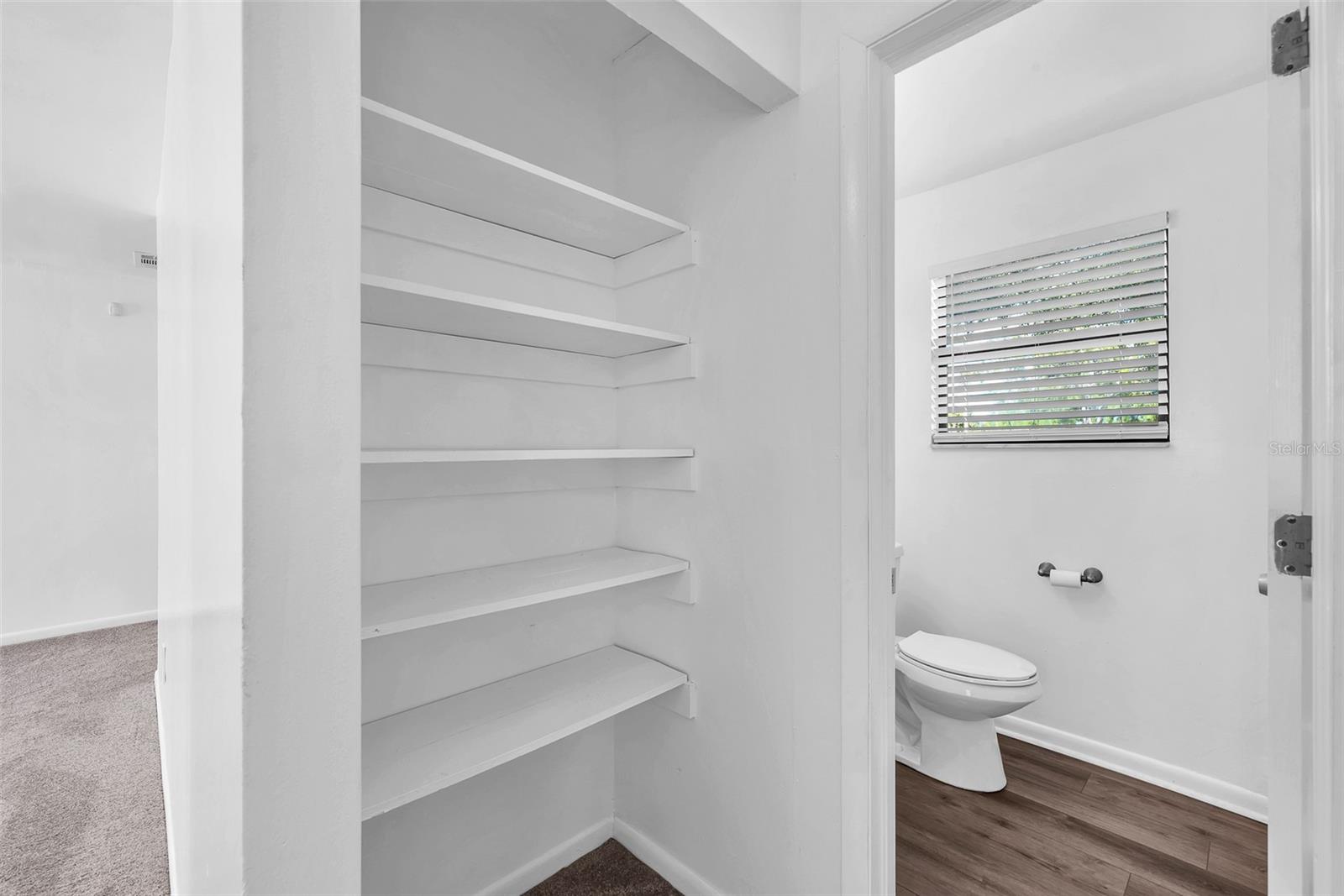 Storage closet in Hall outside of bathroom