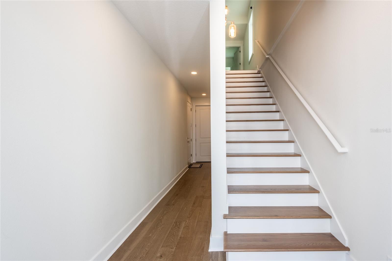 First floor steps w/ elevator behind