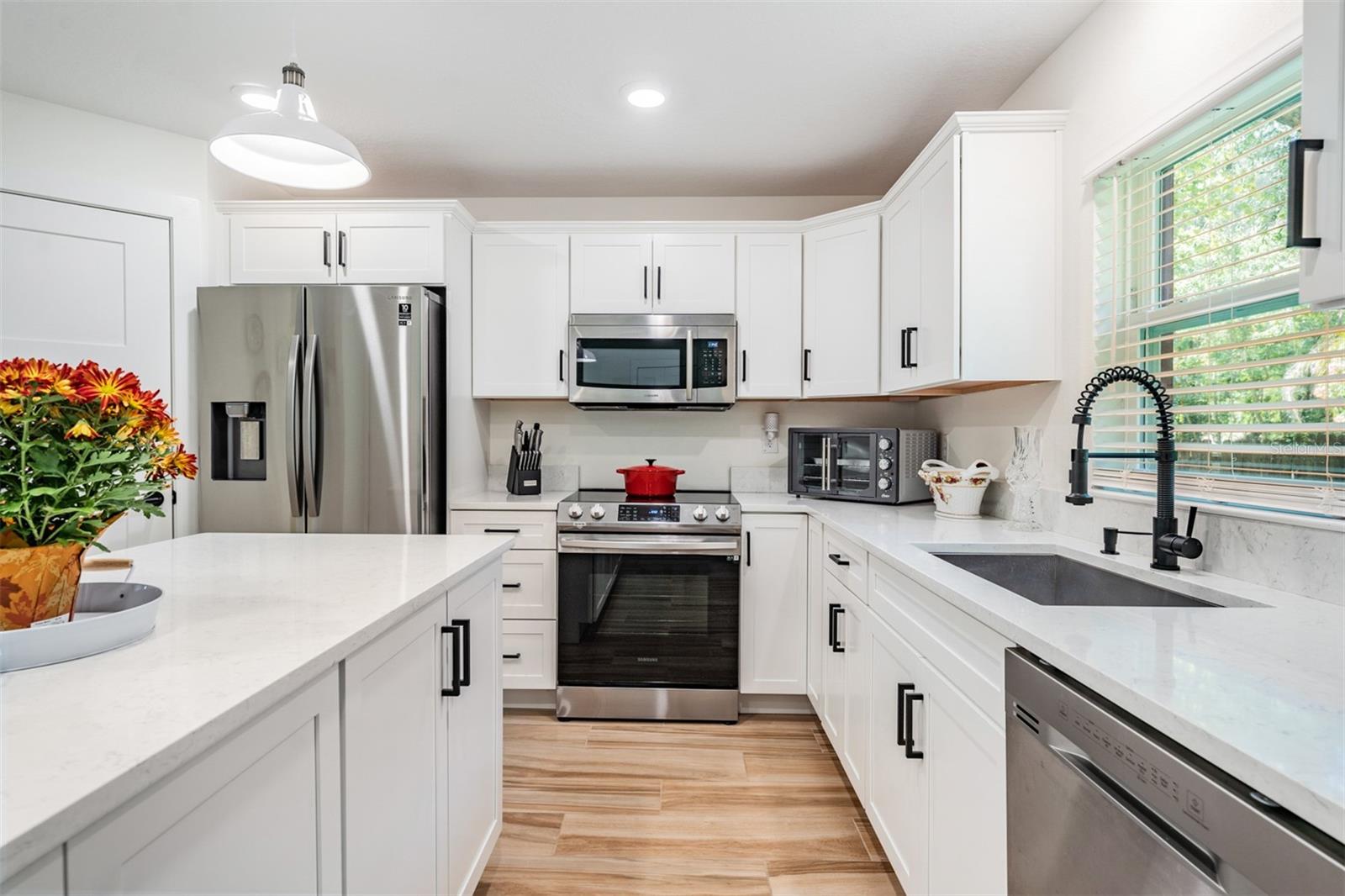 Quartz counters in this gleaming kitchen...