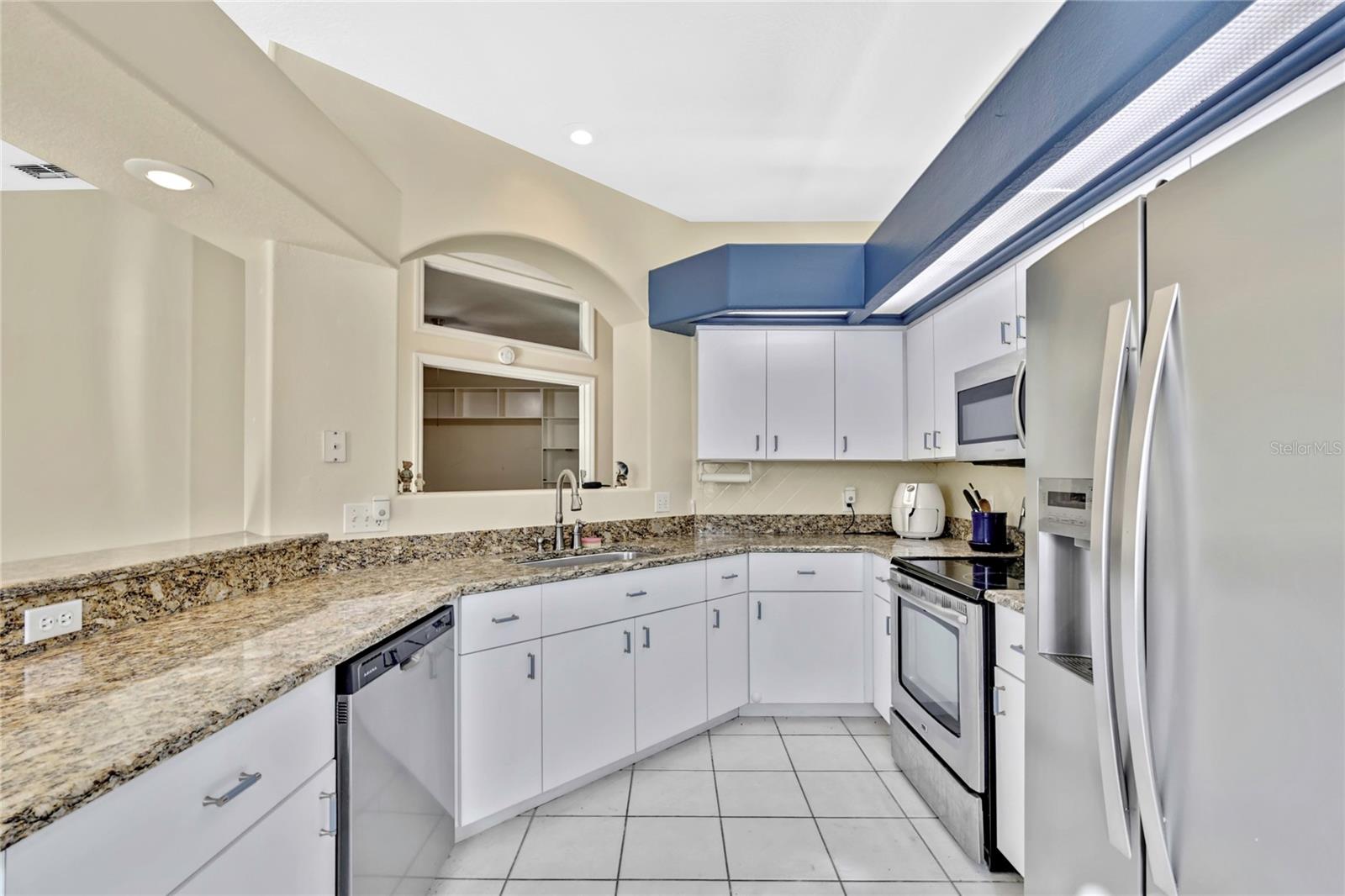 You will never run out of beautiful counterspace in this kitchen.
