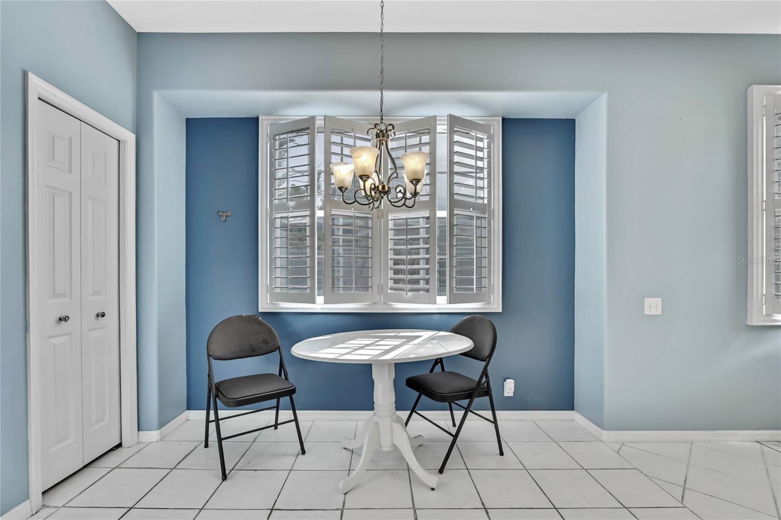 Plantation shutters highlight the eat-in kitchen and are present throughout the home.