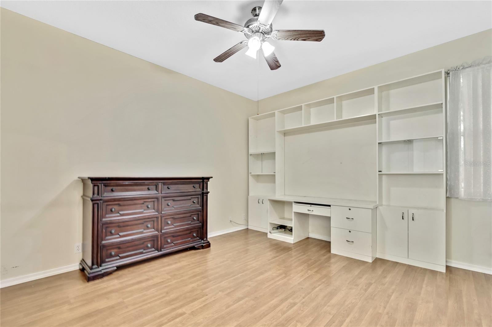 "Bedroom 3" can be used as a spacious sleeping area (no closet) and has a built in work area.