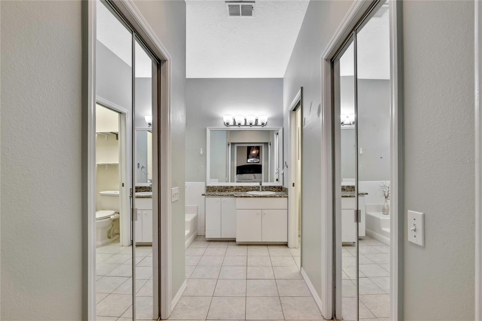 The primary bedroom has a large ensuite bathroom past two sizable walk-in closets.