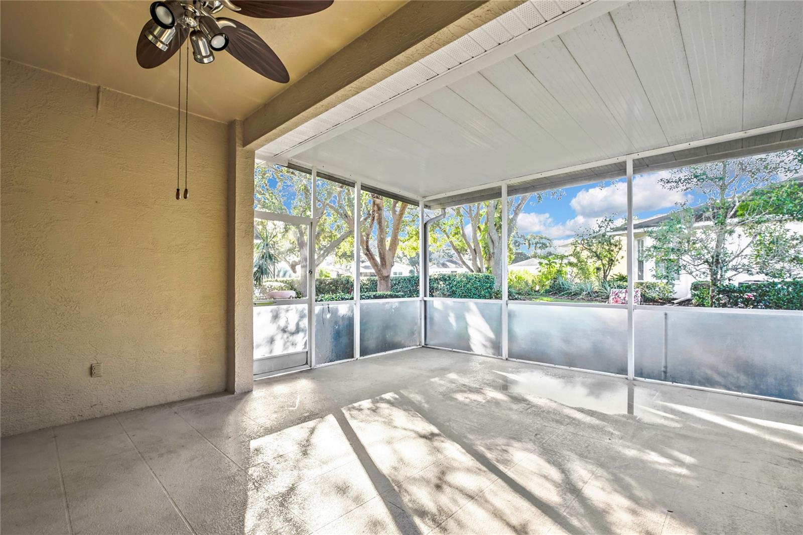Covered patio has nice view of mature landscaping and peaceful surroundings.