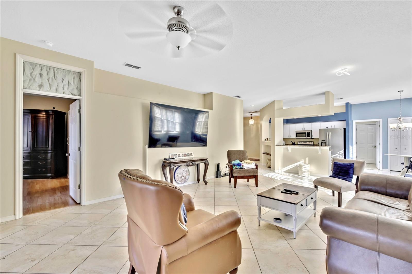 Extra-large 18" tiles in the living room are laid at an angle, providing a custom, designer feel.