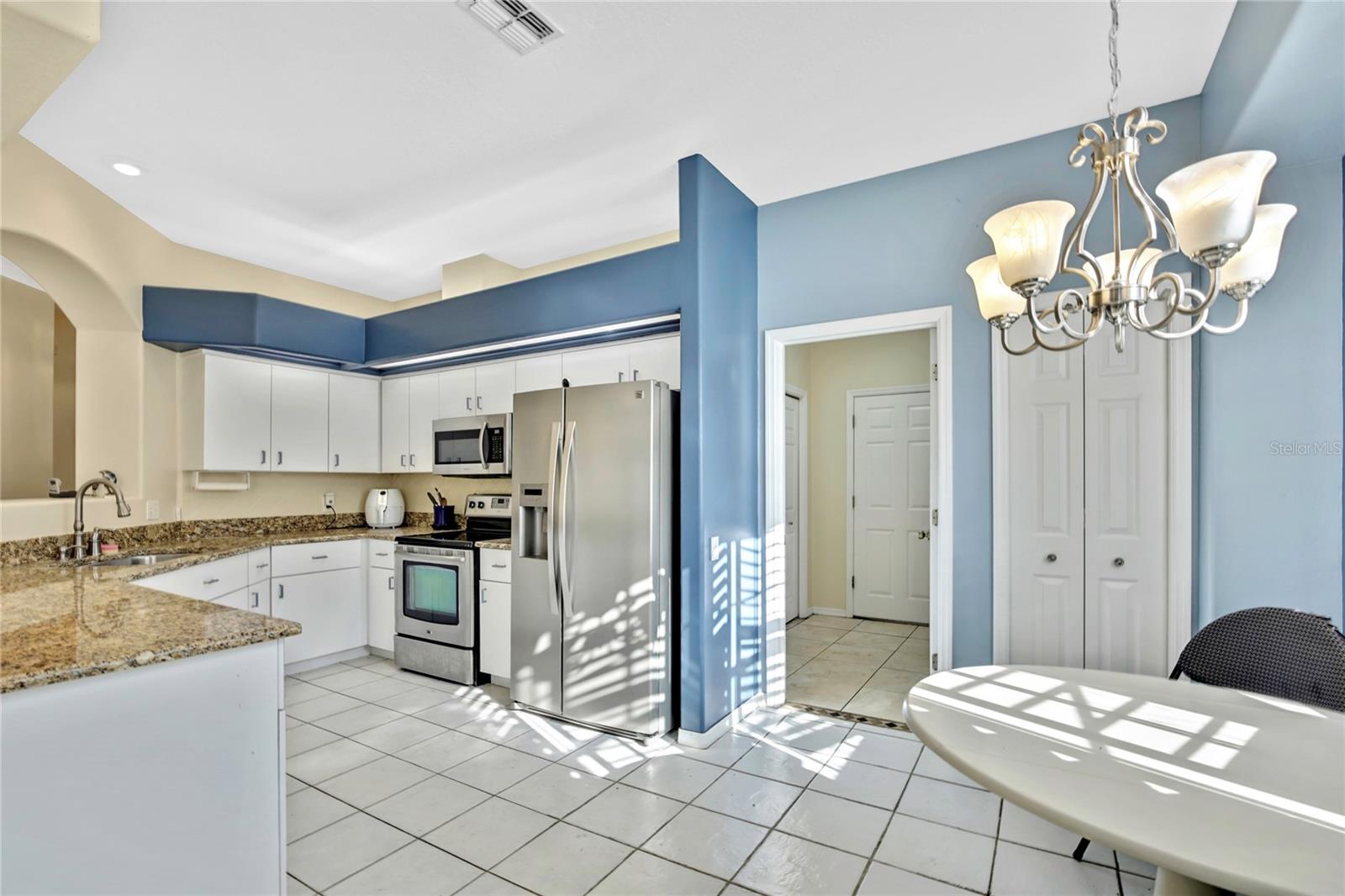 Or, you can keep it a private party for two. Granite countertops and stainless steel appliances upgrade your cooking and dining options.