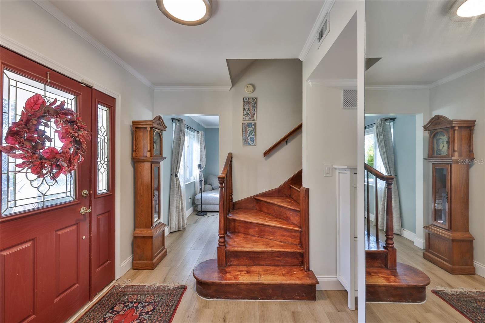 Entrance with natural wood staircase