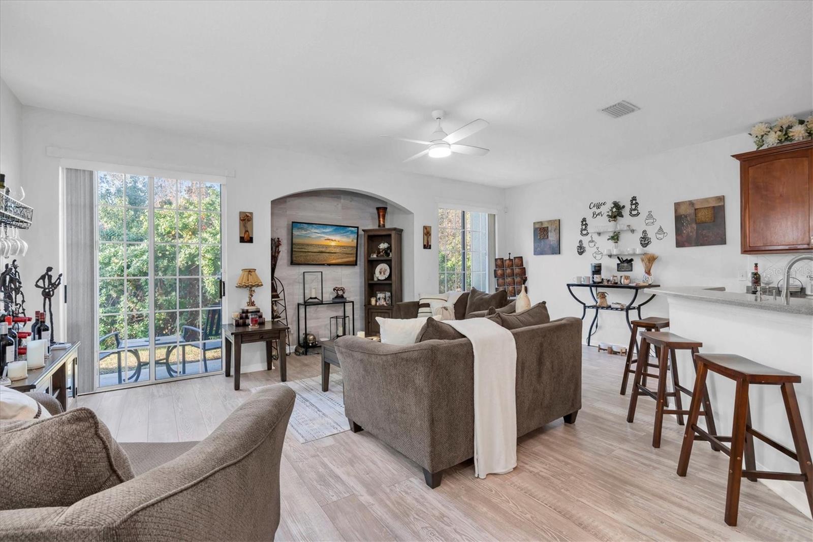 Great room with niche and view to conservation