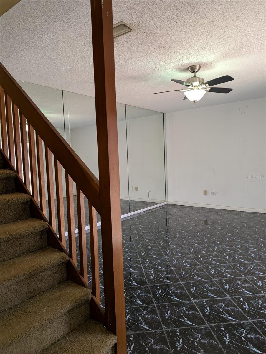 Livning area and stairway to bedrooms