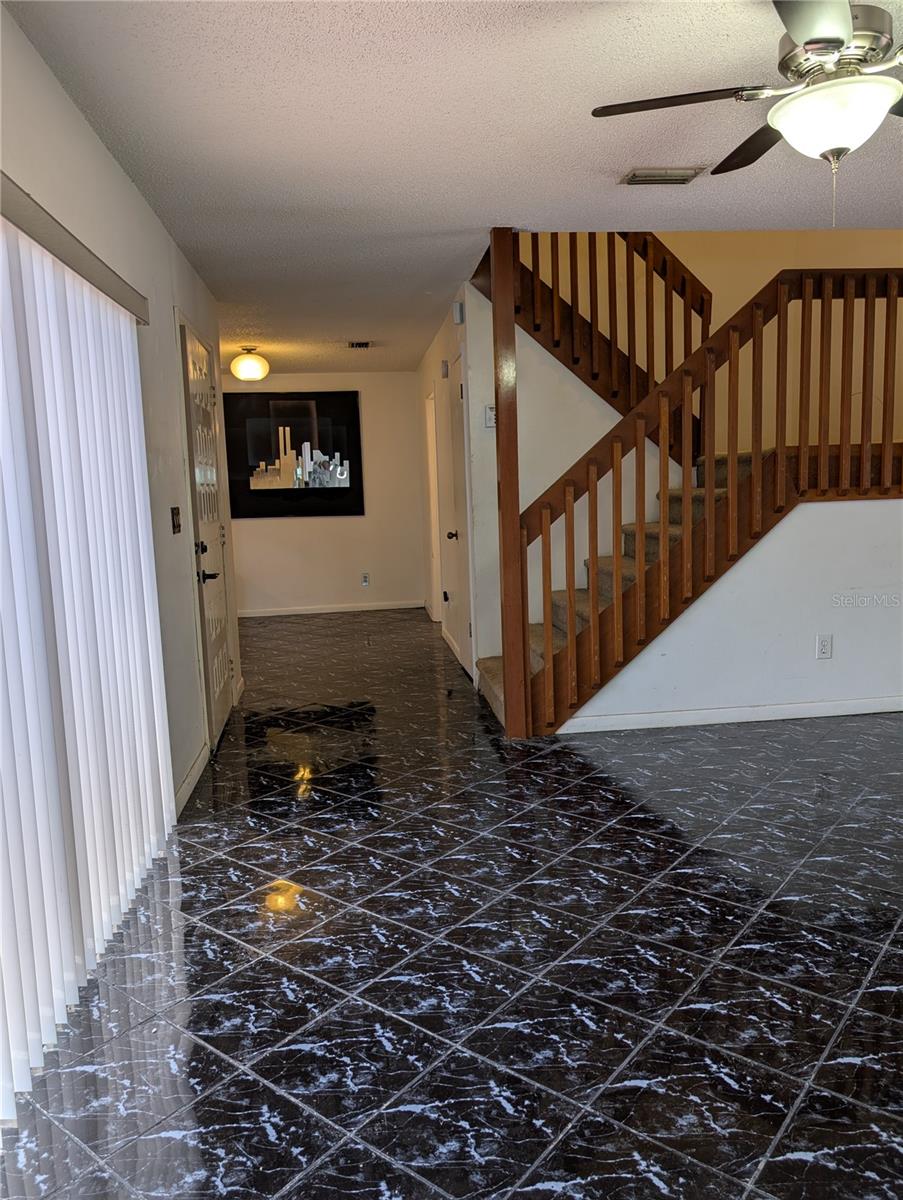 Lining area with Glass sliding doors to patio area and looking onto dining area.