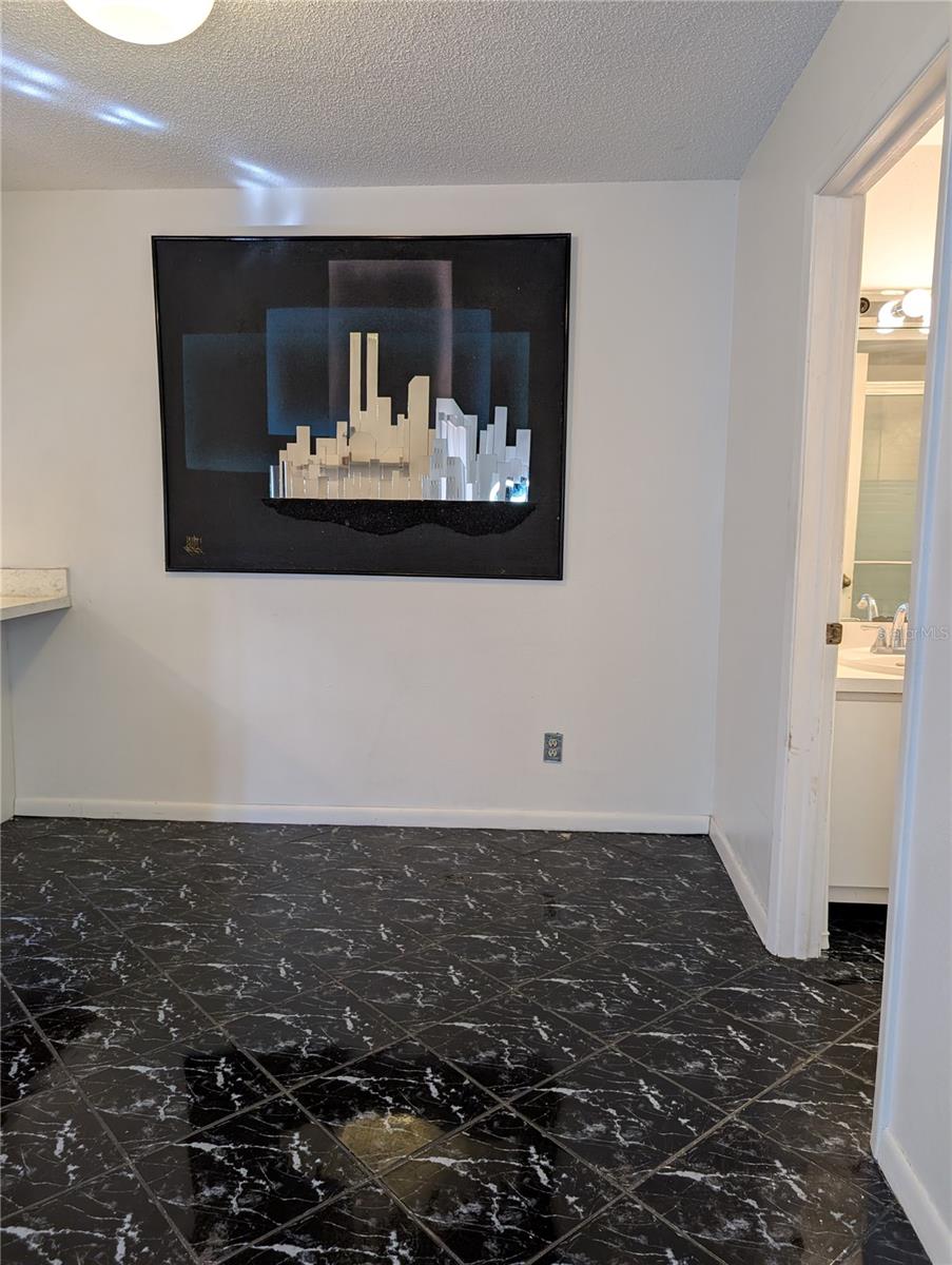 Dining area and downstairs bathroom to the right.