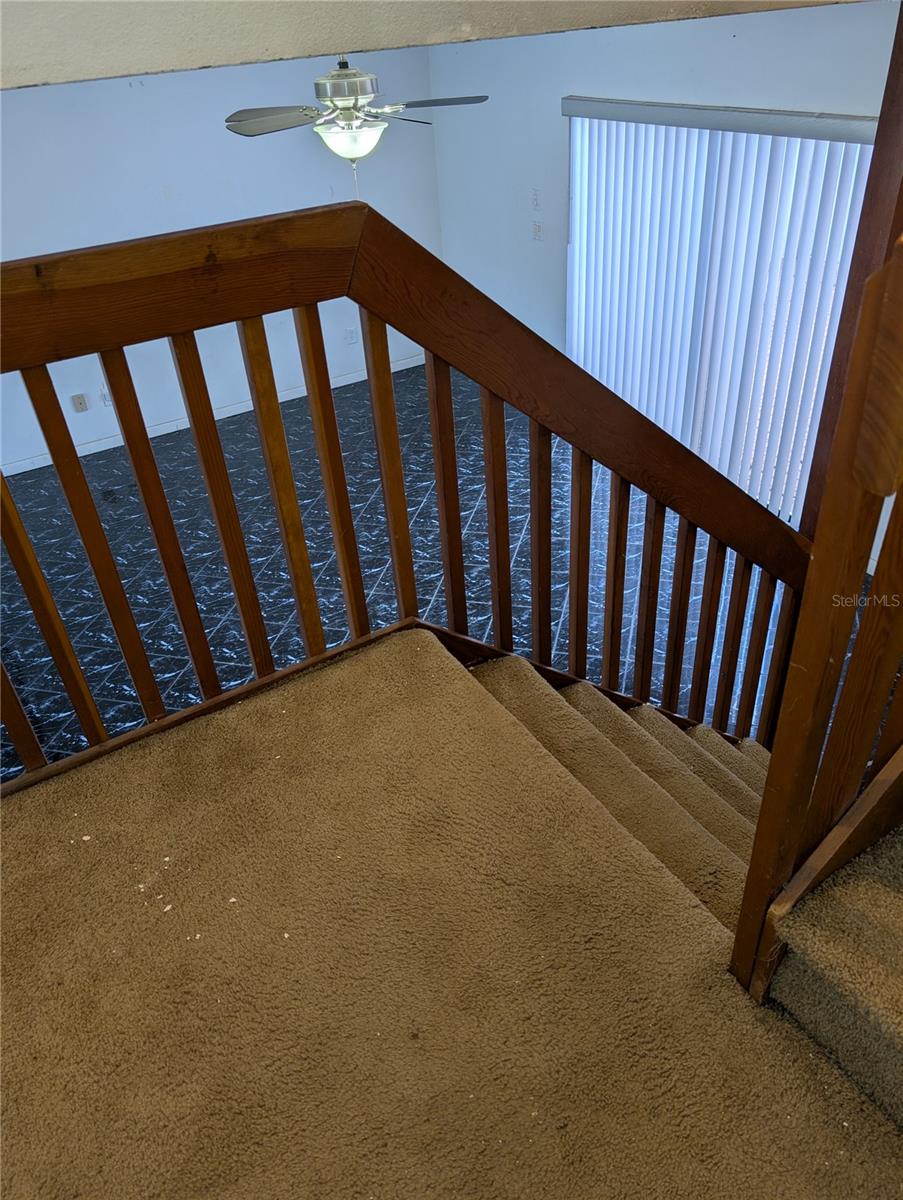 Middle platform of stairs looking onto Living area