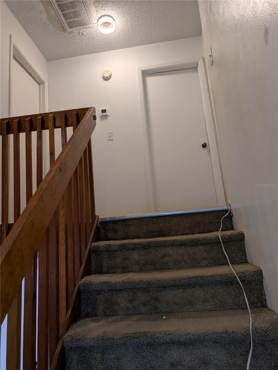 Stairs looking toward bedroom areas