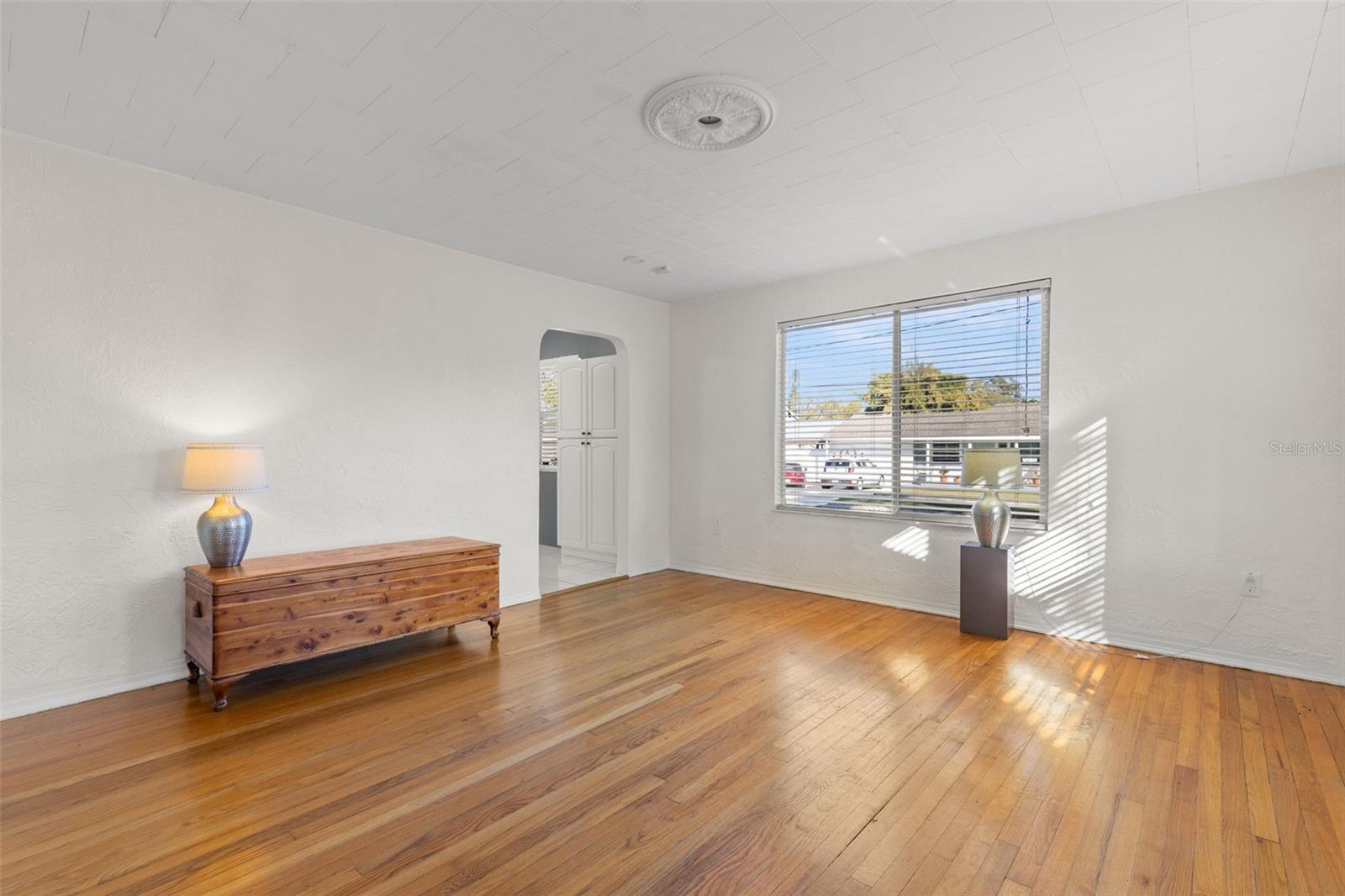 Light and bright living room with original hardwood floors