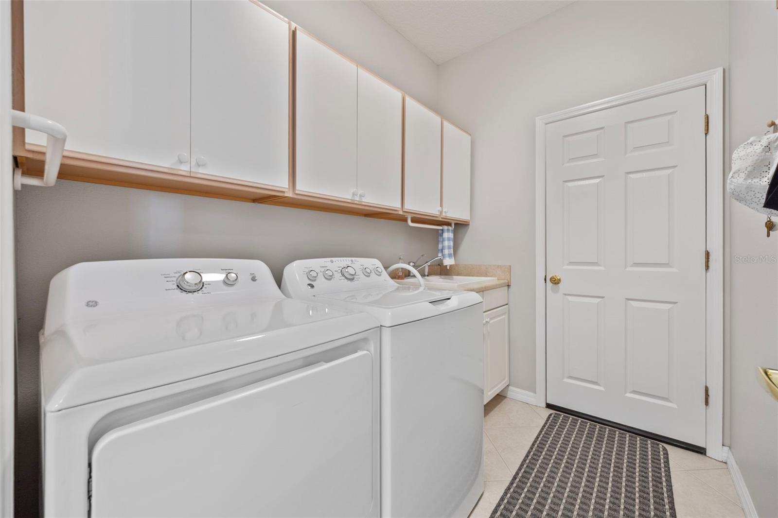 indoor laundry with utility sink