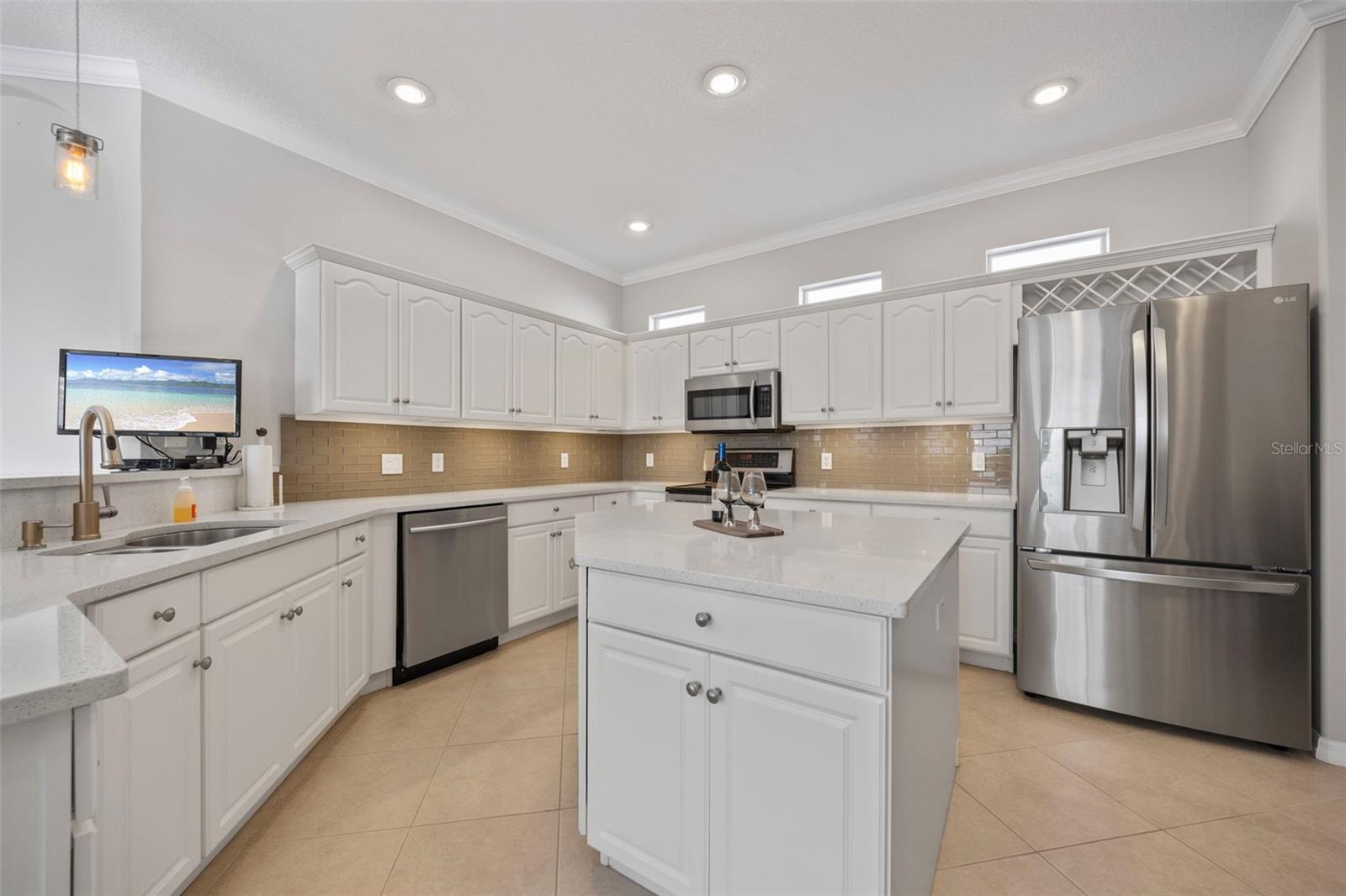 huge kitchen with oversized island & plenty of storage