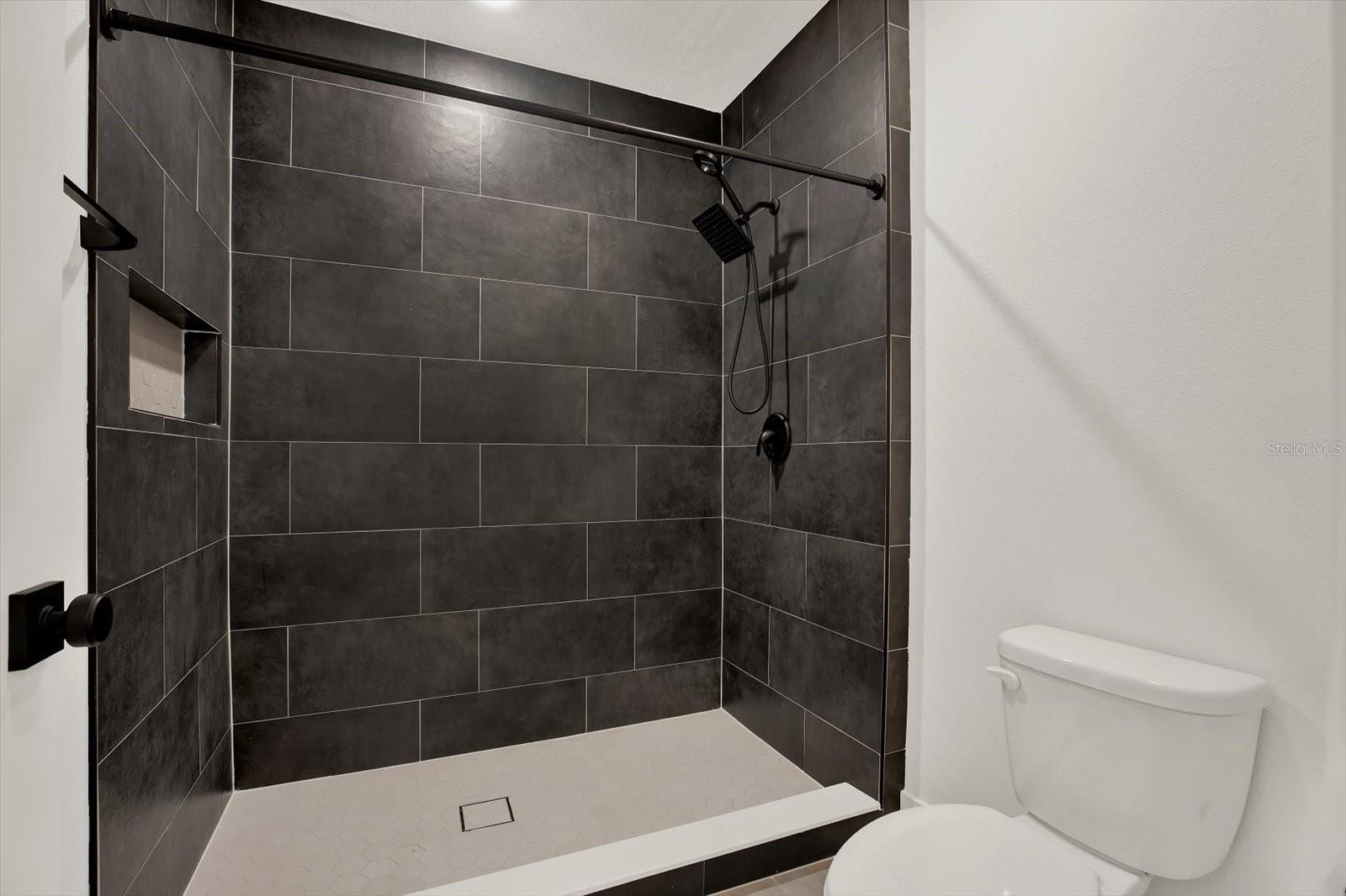 CUSTOM ABOVE BUILDER GRADE TILE SHOWER