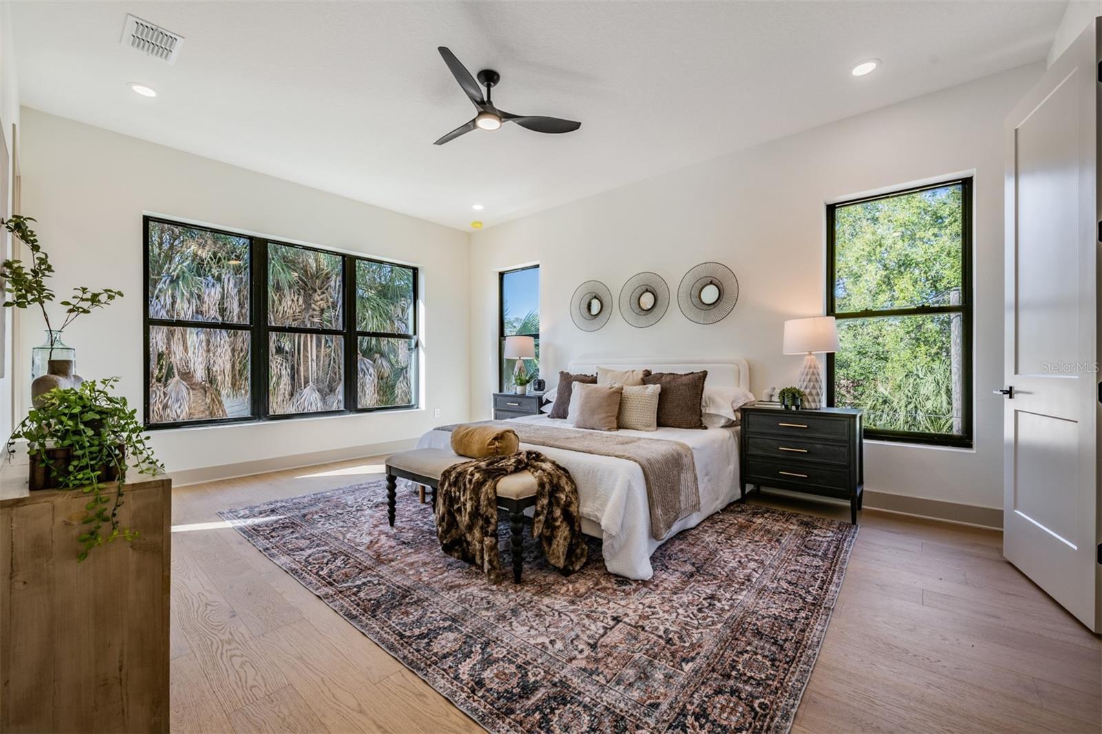 Spacious primary suite filled with natural light