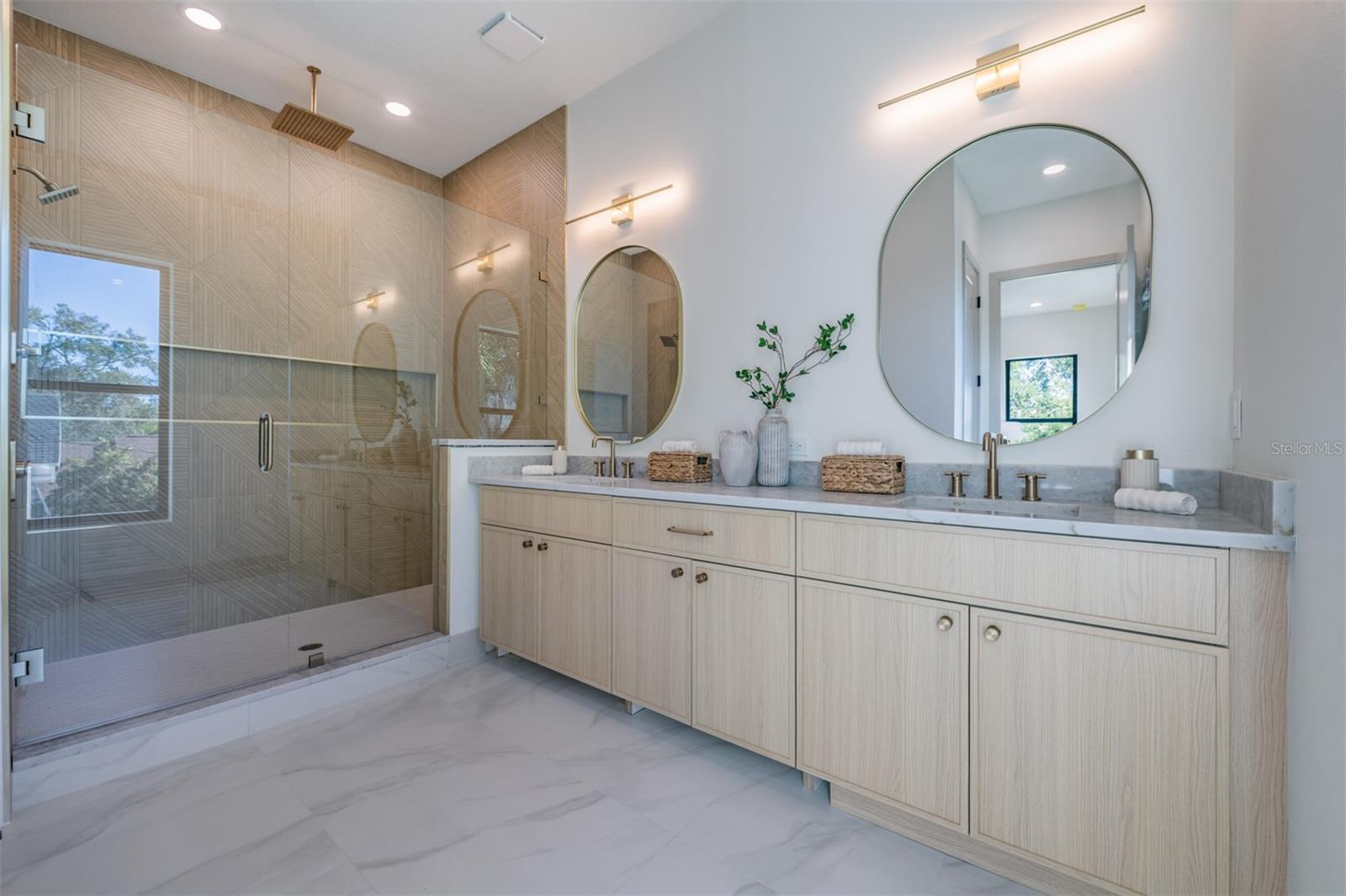 Elegant primary bath with dual sinks and designer finishes