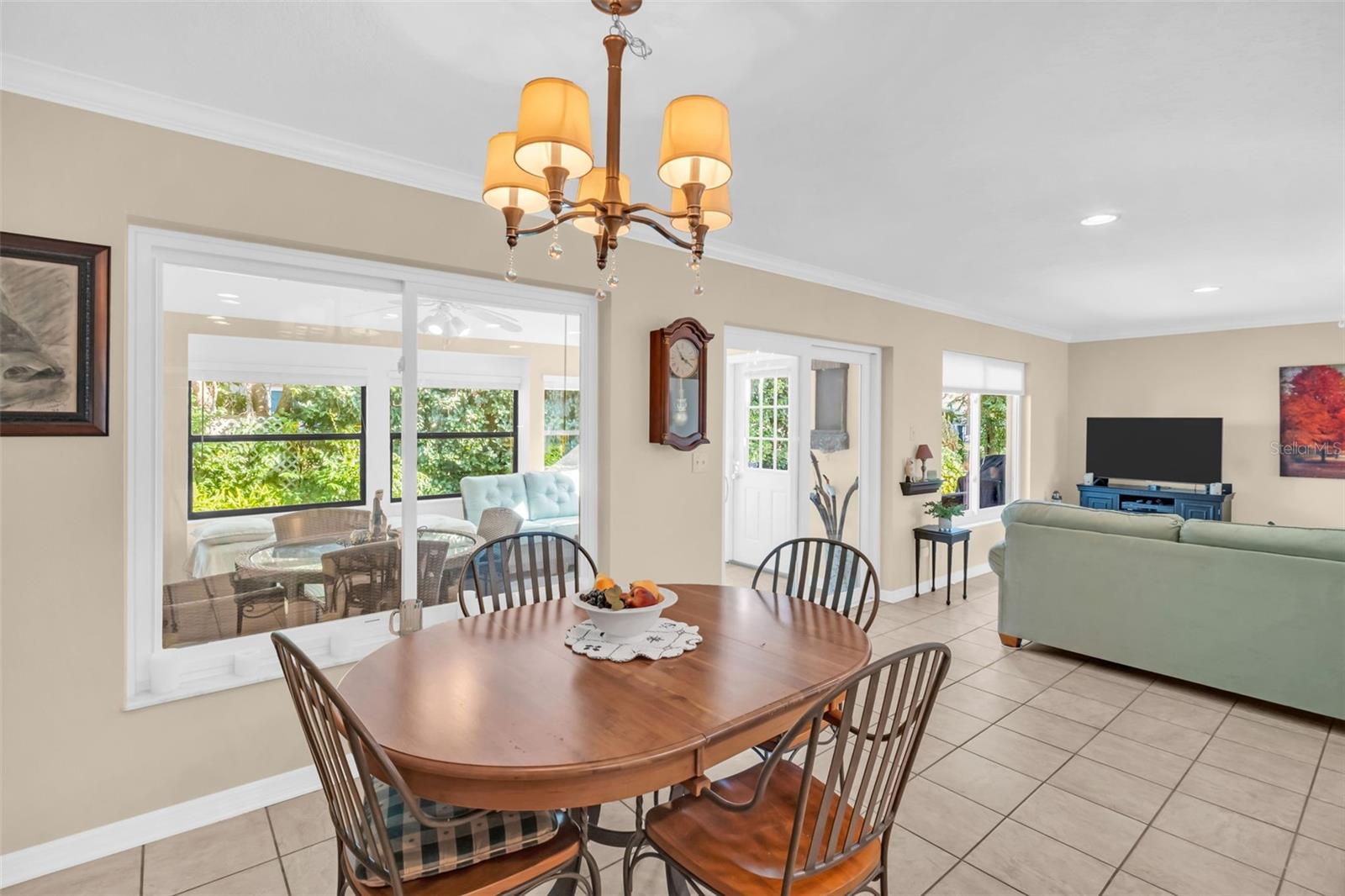 Large sliders open to the heated & cooled bonus room offering a possible 3rd bedroom, office, or whatever your heart desires~