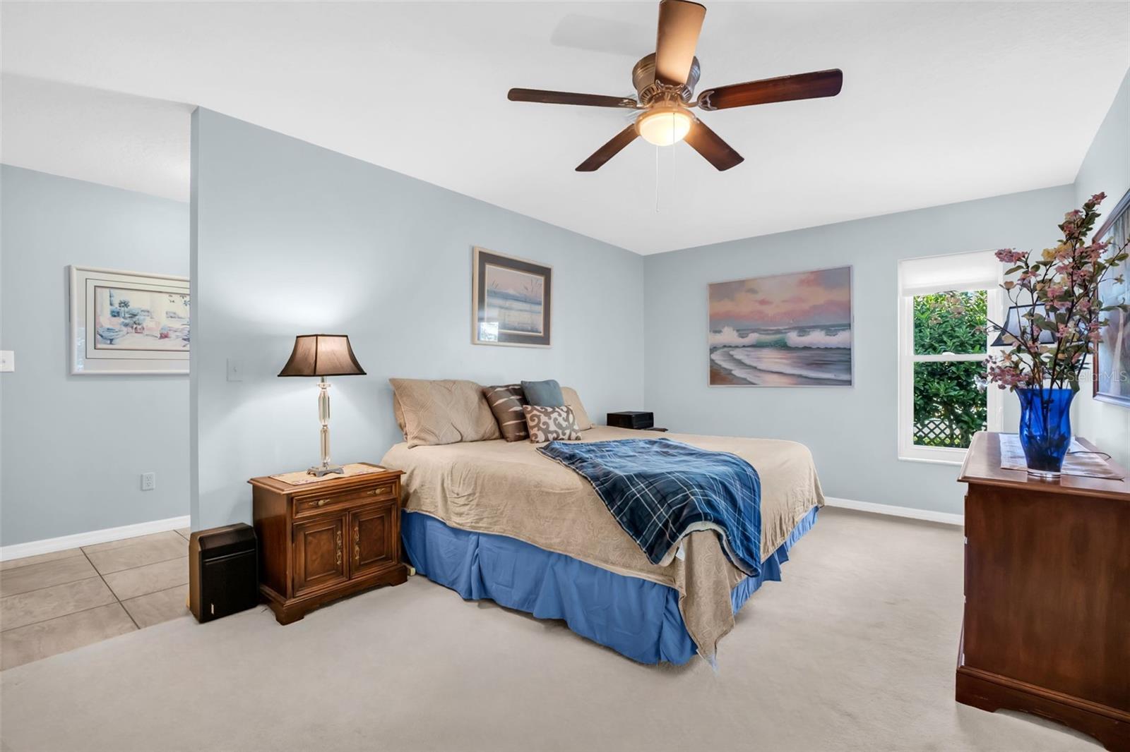 Massive primary retreat offering private green views, a dressing room with a walk-in closet to the updated en-suite bath~