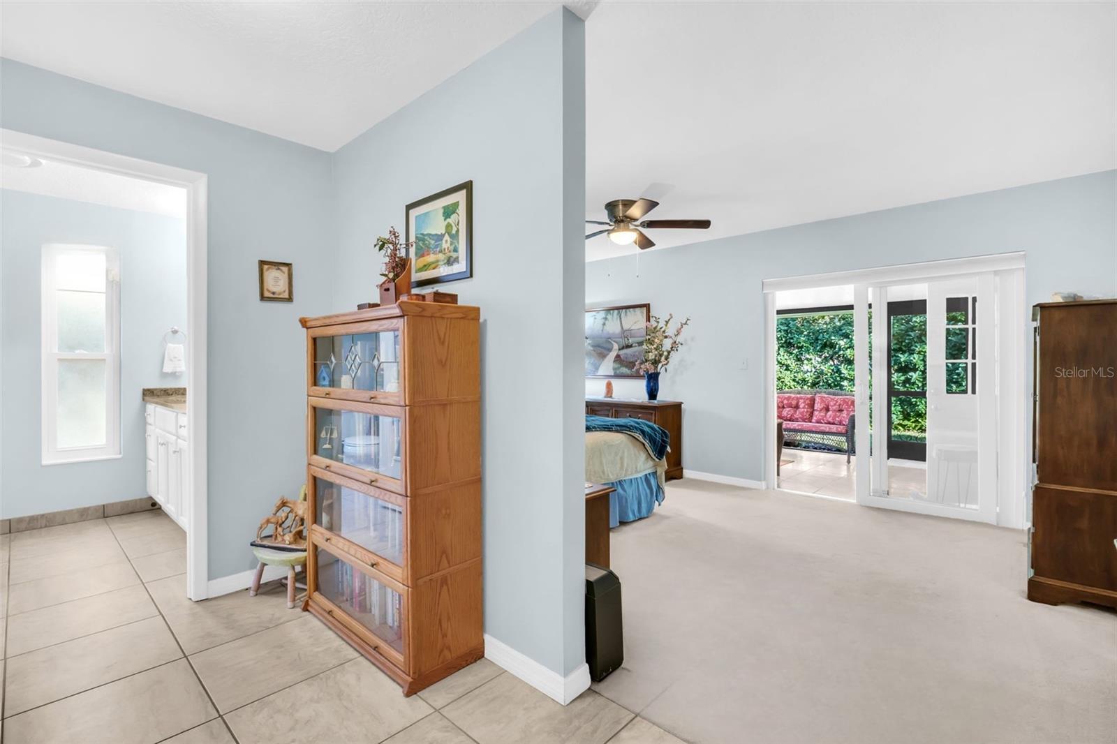 Primary suite offers a convenient dressing room with a walk-in closet~