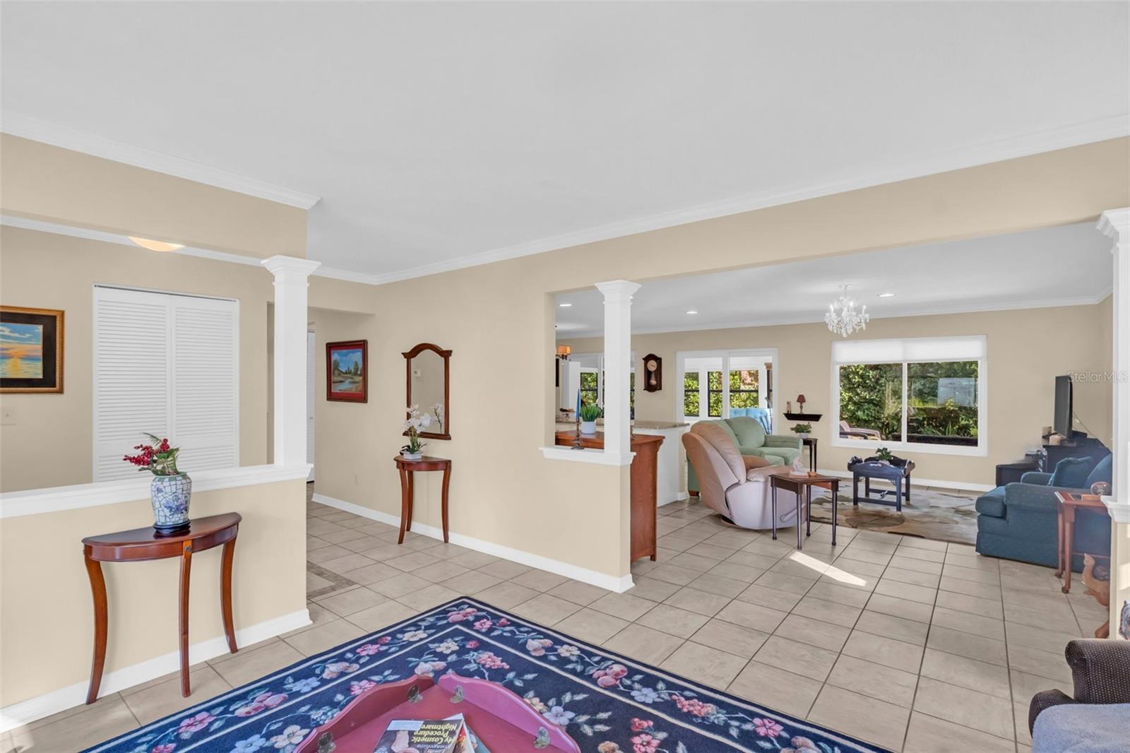 Front entry coat closet, beautiful crown molding, and open to the main living~