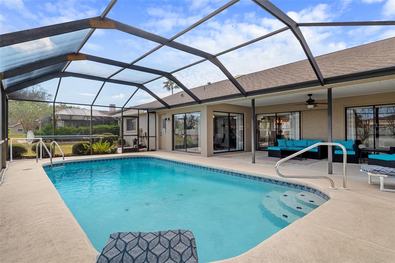 Newly rescreened enclosure around the sparkling private pool/patio with plenty of covered area to seek shade on hot days!