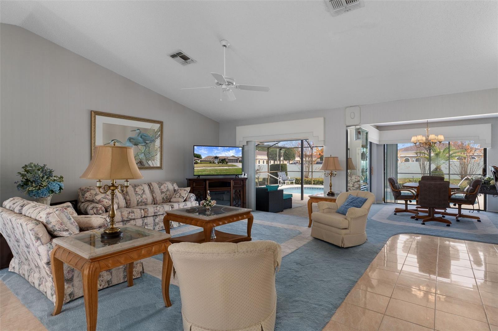 Great view from formal dining room into living area, patio/pool and breakfast nook.