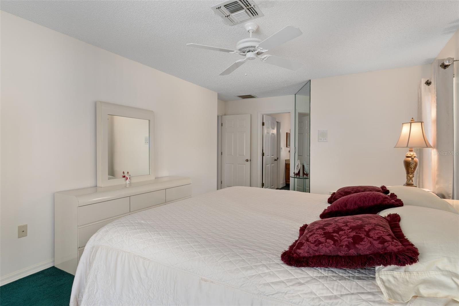Primary suite spans the entire side of the house and has a large en-suite bathroom.