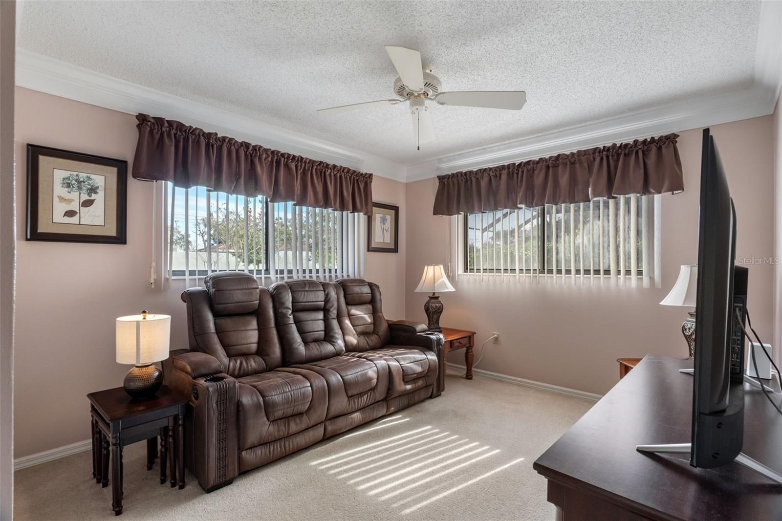 Bedroom 3 is currently used as a den with reclining couch & TV