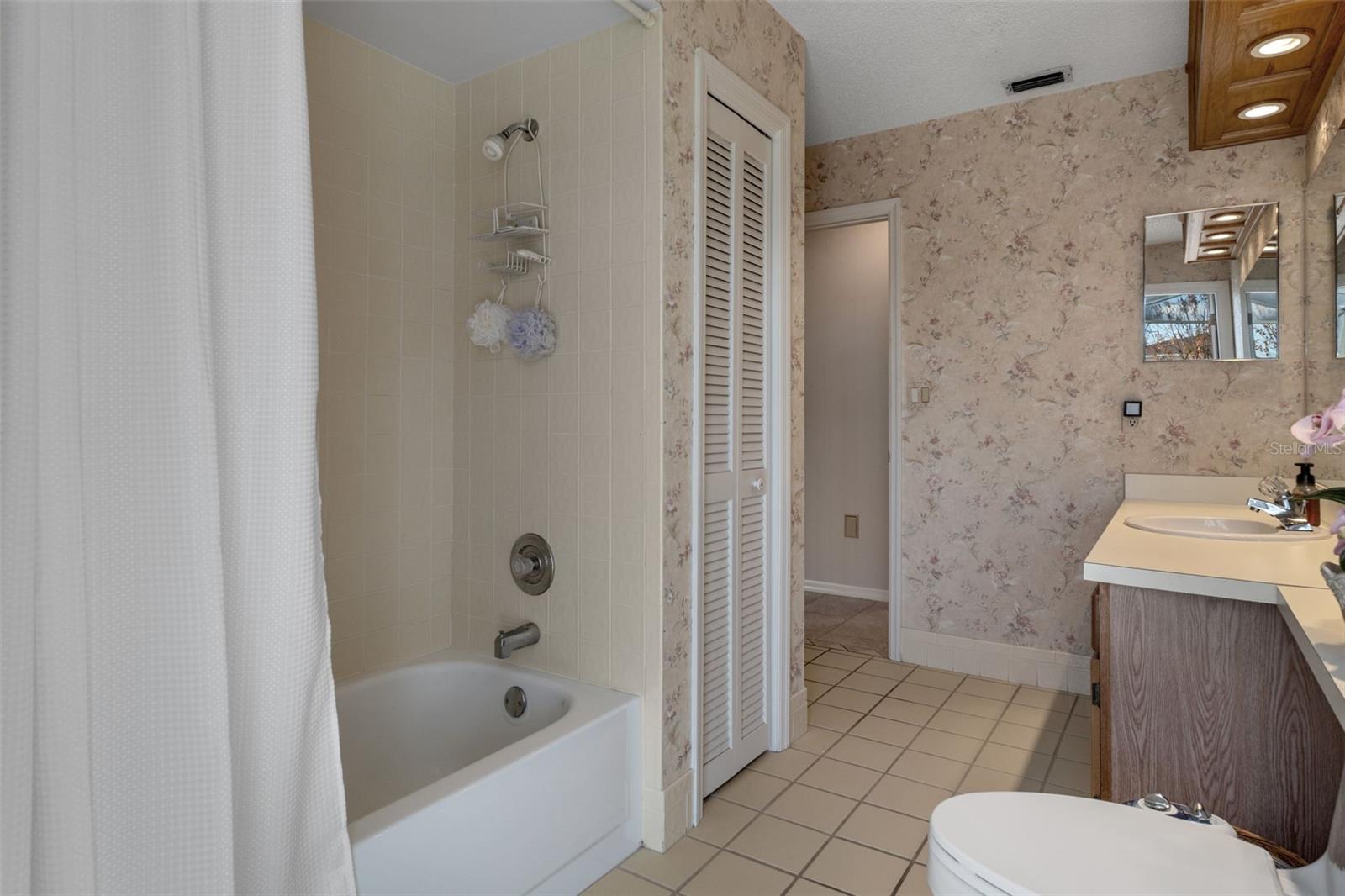Bathroom 2 offers a tub/shower combo and has a linen closet, single vanity and a newer toilet w/ bidet attachment.
