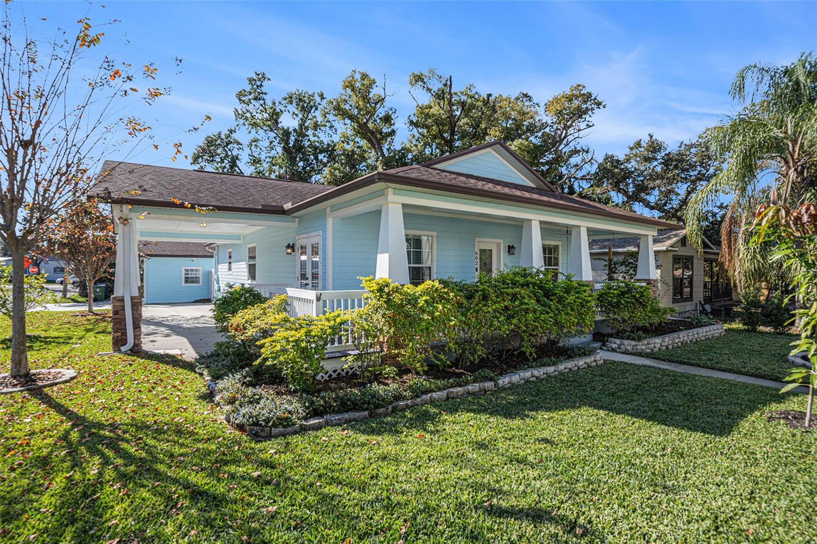 Corner view of home and attached carport