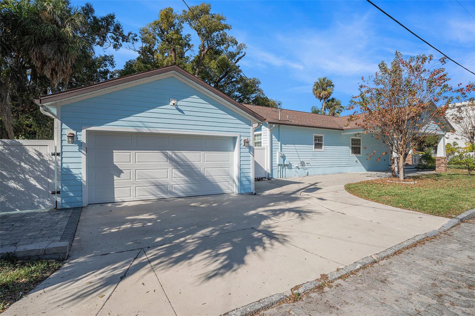 Large driveway with detached 2 car garage and carport, plenty of parking!